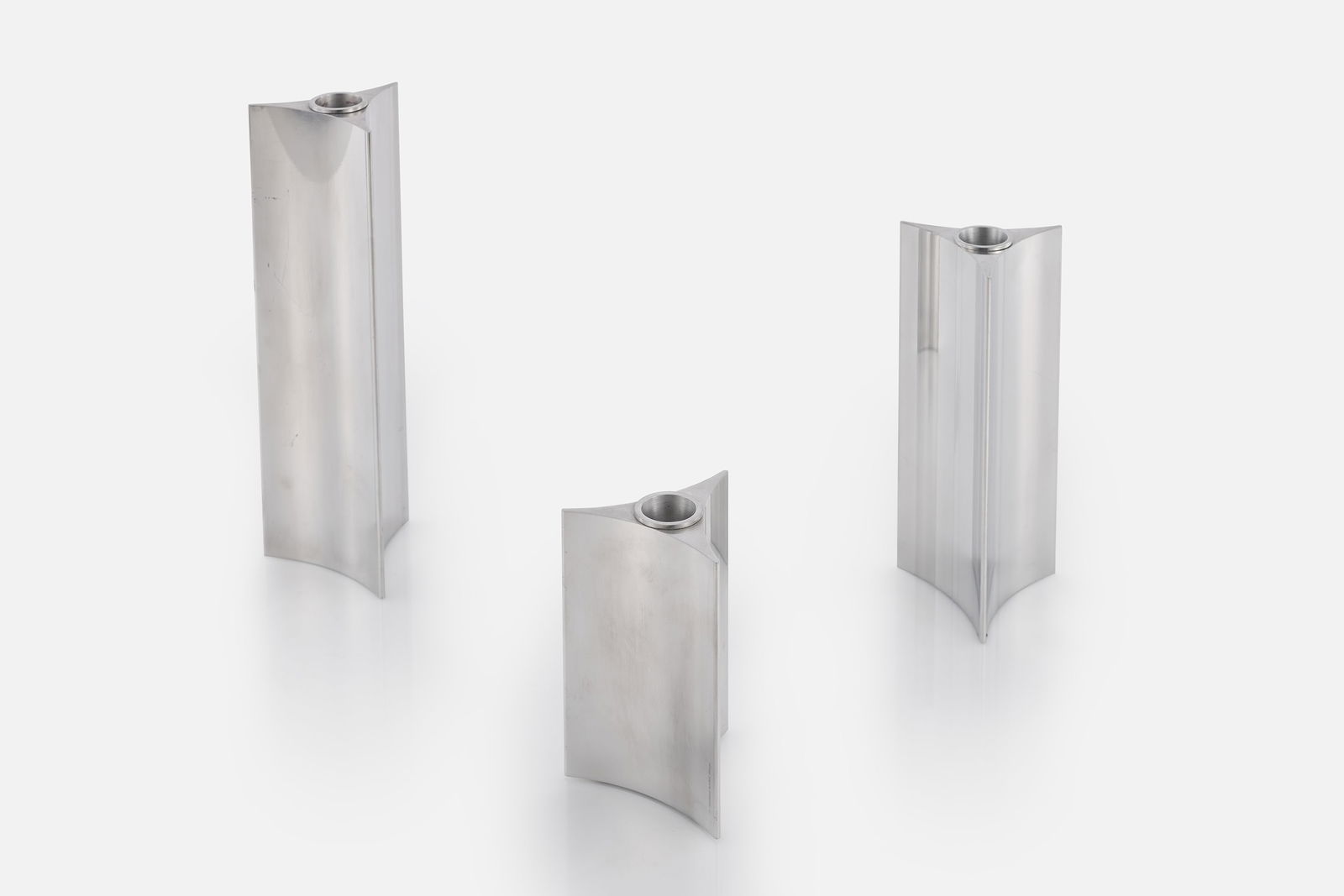 Verner Panton, 'Starlight' Candlesticks (3): VERNER PANTONSet of three 'Starlight' candlesticks, 1991Polished aluminum. Manufactured by Georg Jensen, Denmark.Impressed manufacturer's mark to side of each example "Georg Jensen De