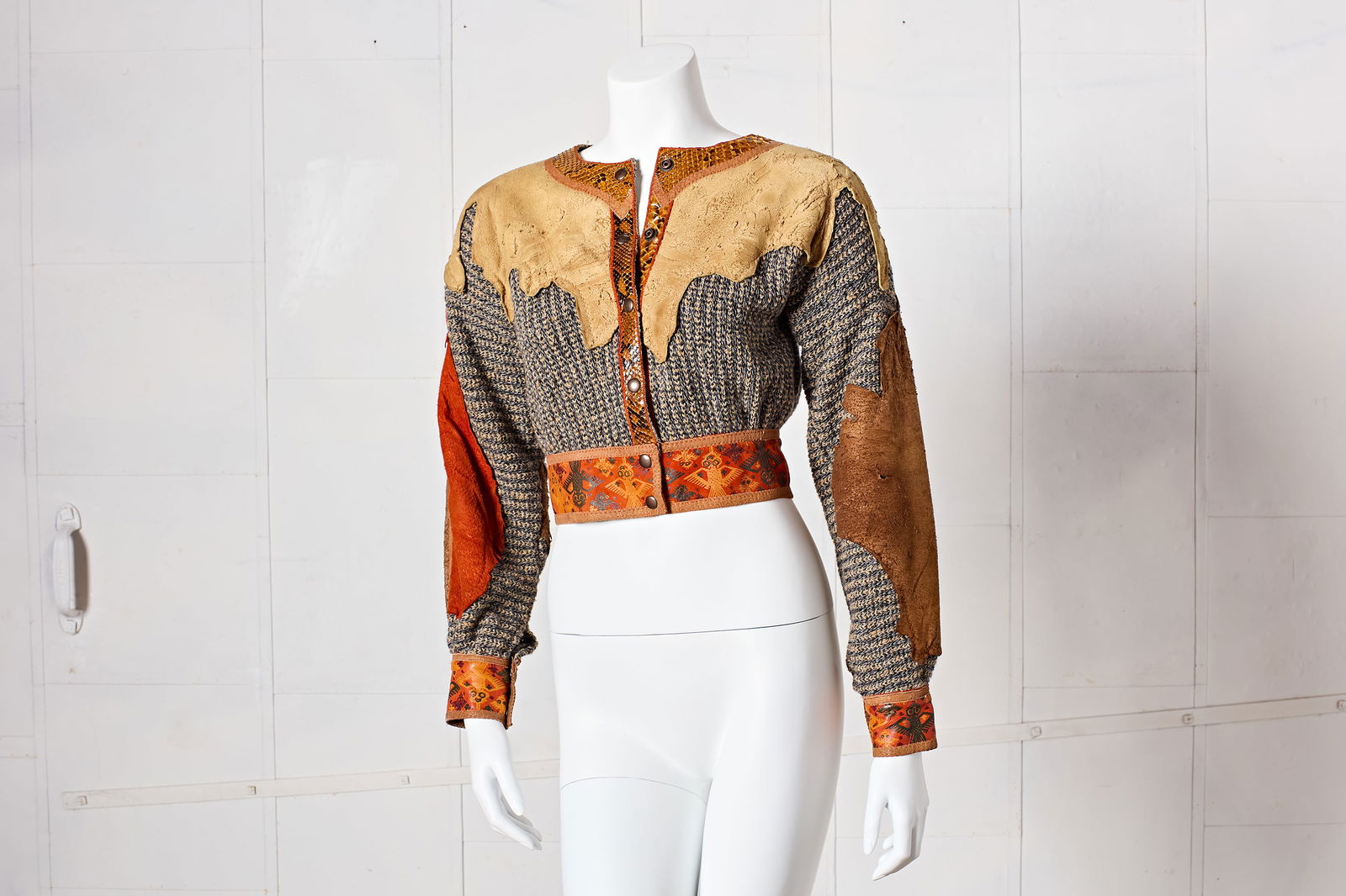 Roberto Cavalli, Early Patchwork Jacket: ROBERTO CAVALLIEarly patchwork jacket, 1970sSuede, knit, python. Roberto Cavalli, Italy.Interior with leather label "ROBERTO CAVALLI MADE IN ITALY". Size S; Shoulder to shou