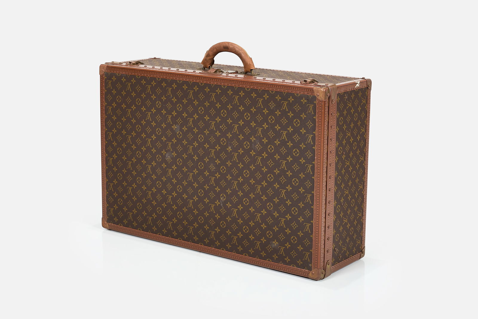 Louis Vuitton, 'Alzer 80' Hard Suitcase: LOUIS VUITTON'Alzer 80' suitcase, 1970sMonogram canvas, canvas, leather, brass. Manufactured by Louis Vuitton, France. Interior with serial number (957362), branded strapping, and branded