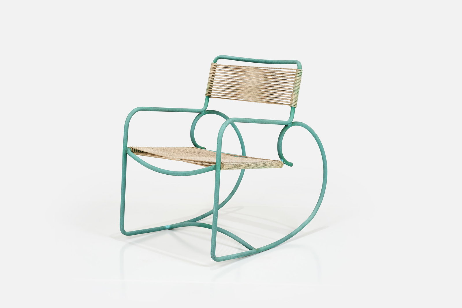 Walter Lamb, Rocking Chair: WALTER LAMBRocking chair, model no. C-5701, 1950sTubular bronze, cotton/nylon cord. Manufactured by Brown Jordan, USA.Underside with manufacturer's label. 31.5" H x 21.5" W x