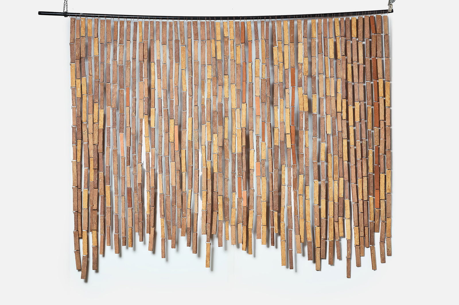 Stan Bitters, Large Sun Screen: STAN BITTERS Large sun screen Unglazed earthenware. Studio-made, Fresno, CA. 72 H x 96" W 