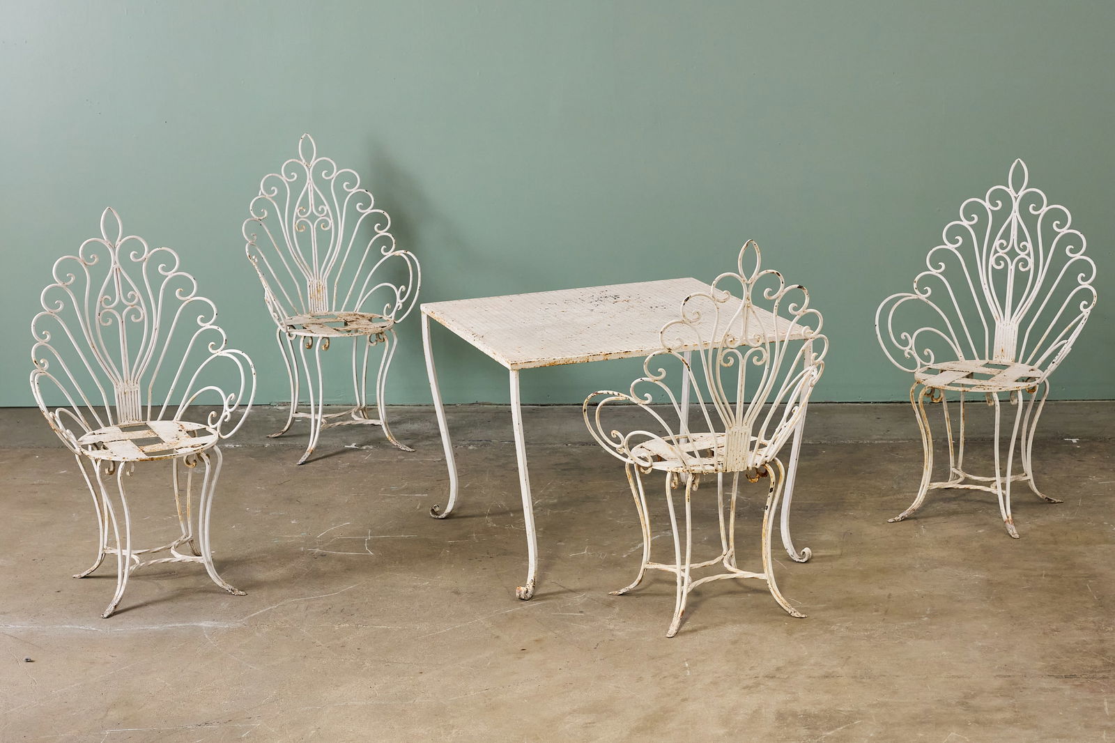 Satlerini Style, 'Peacock' Dining Set (5): SALTERINI STYLE 'Peacock' dining set, 1950s Painted iron. Table: 27" H x 36" W x 36" D Each chair: 42.5" H x 23" W x 17" D Seat height: 17.5"