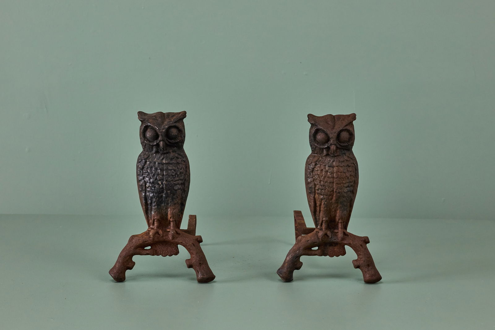 American, Owl Andirons (2): AMERICAN Pair of owl andirons, early 20th century Painted cast iron. Each: 13.75" H x 8.5" W x 15" D
