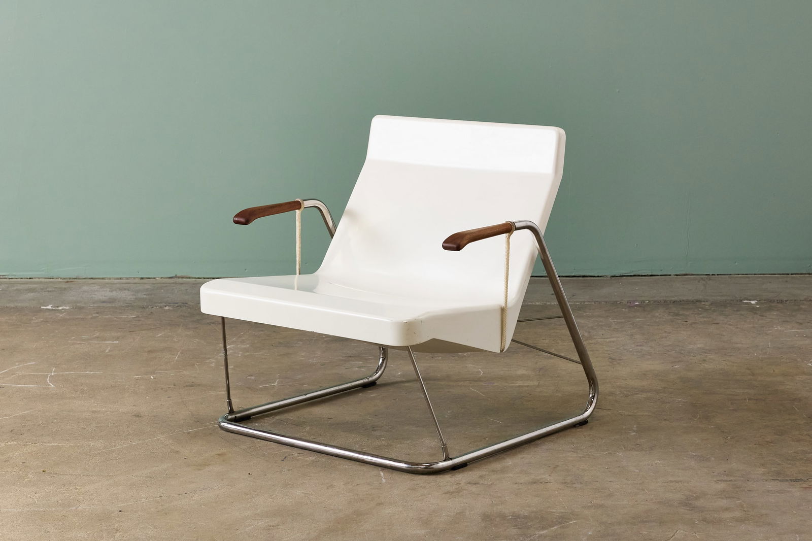 Chris Deam, 'Glider' Lounge Chair: CHRIS DEAM 'Glider' lounge chair, ca. 2003 Fiberglass, stainless steel, nautical-grade aramid fiber ropes, carved walnut. Manufactured by Lolah, USA. 30.75" H x 30.5" W x