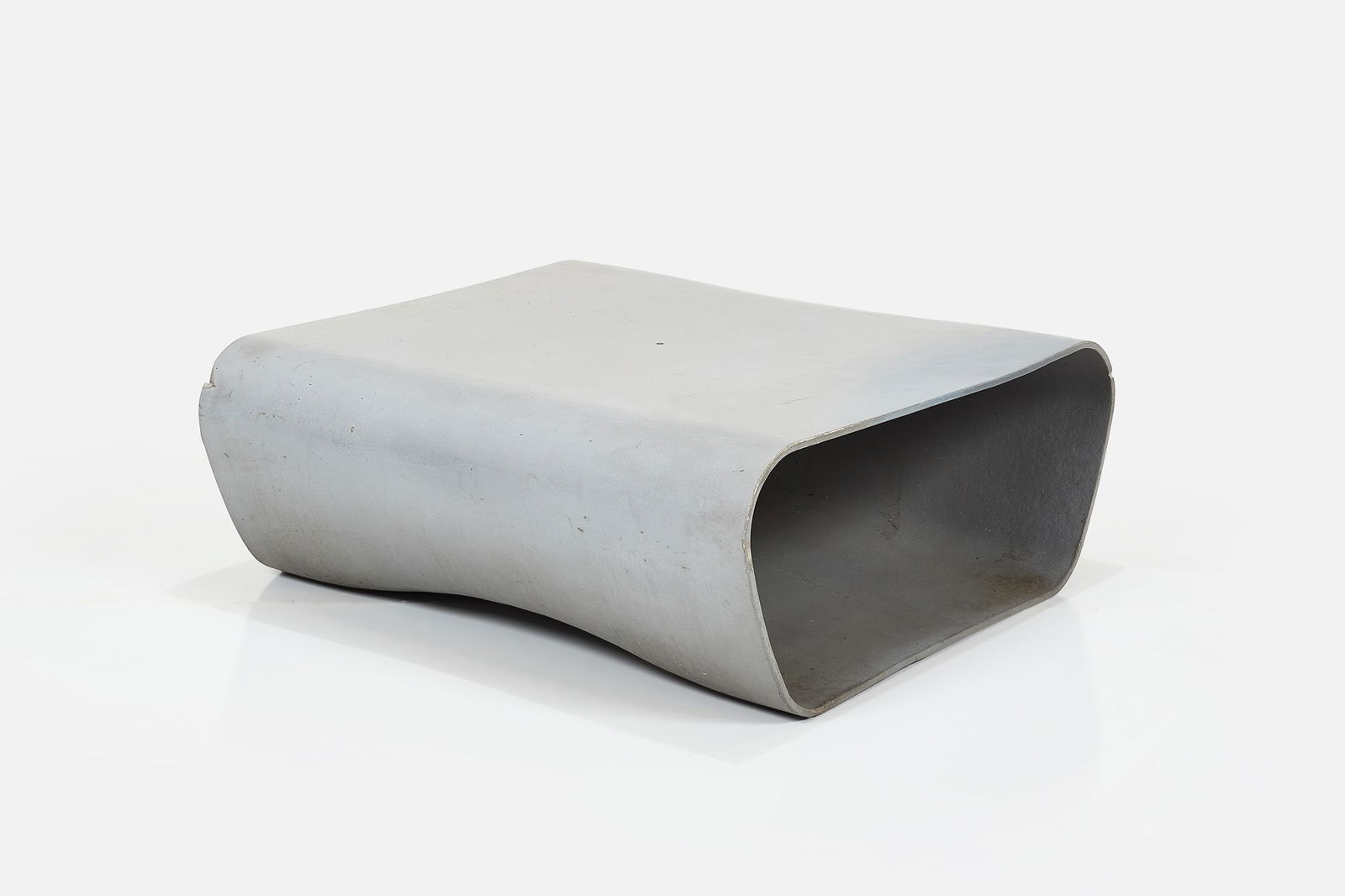 Rainer Mutsch, 'Dune' Bench: RAINER MUTSCH 'Dune' bench, 2010s Cast concrete. Manufactured by Eternit, Switzerland. Side impressed with manufacturer's mark. 14.25" H x 37.5" W x 35.25" D