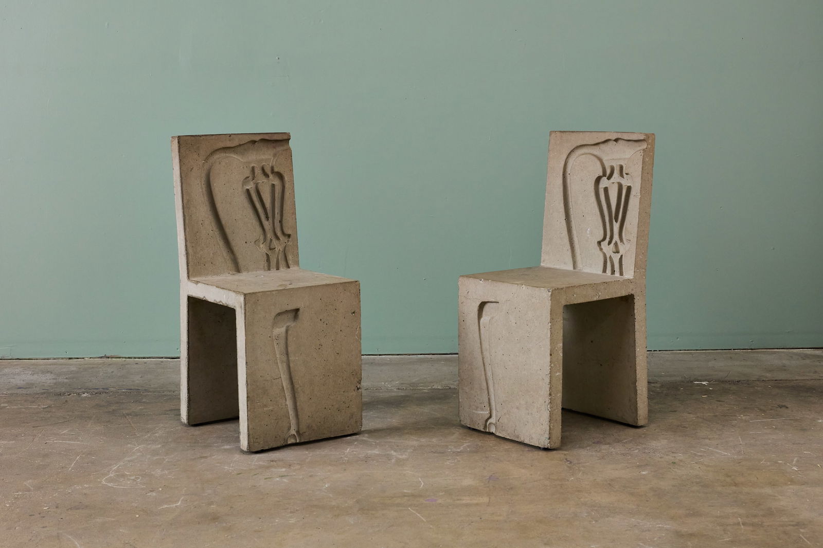 Workhaus Projects, 'Musical' Chairs (2): WORKHAUS PROJECTS Pair of 'Musical' chairs, 2000s Cast concrete. Produced by Workhaus Projects, UK. Each: 34.5" H x 15" W x 16" D Seat height: 18.25