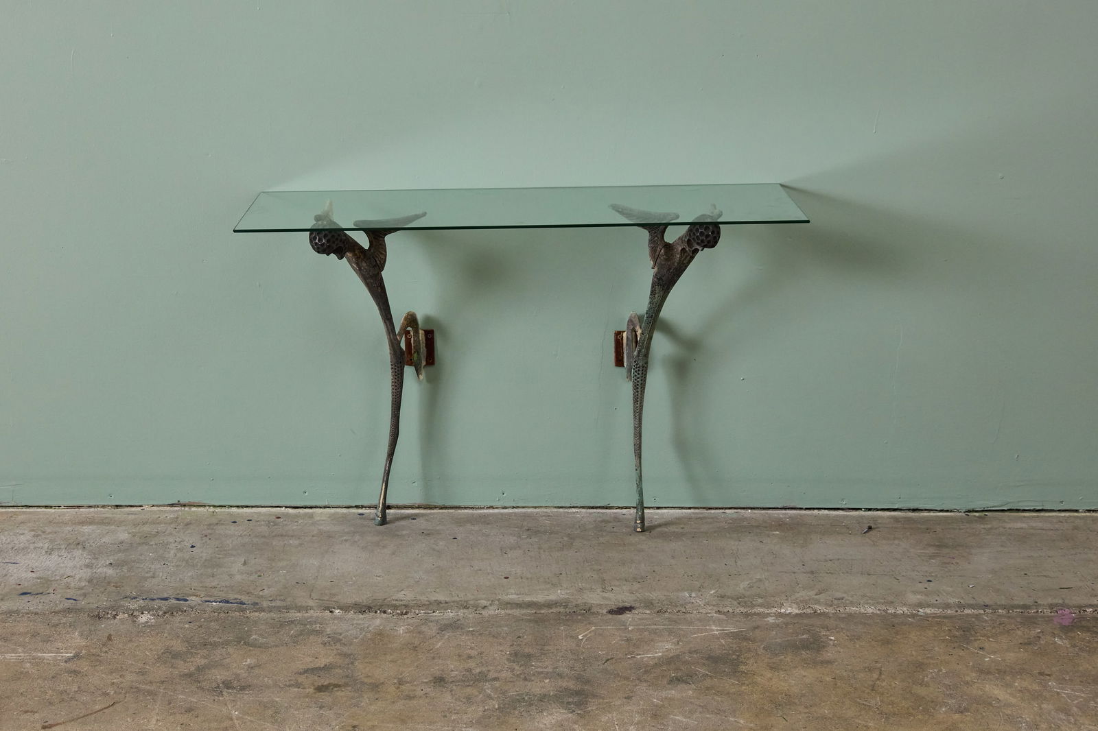 Dan Johnson, Wall-Mount 'Satyr' Console Table: DAN JOHNSONWall-mount 'Satyr' console table, ca. 1956Cast bronze, glass. Produced by Dan Johnson Studio, USA / Italy. 27" H x 42" W x 14" D