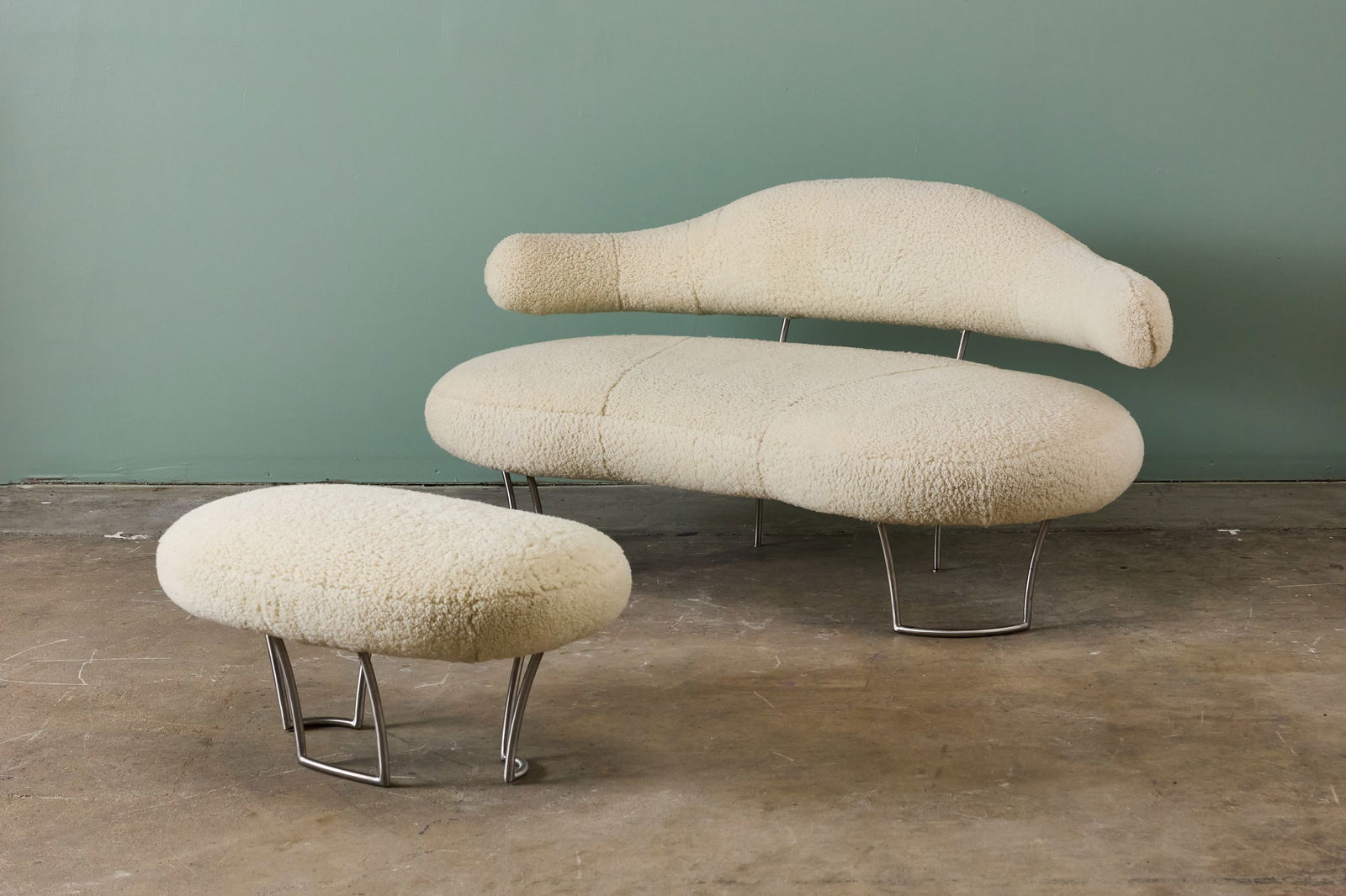 Kevin Walz, 'Borlotti' Sofa + 'Fava' Ottoman (2): KEVIN WALZ 'Borlatti' settee and 'Fava' ottoman, 21st century Sheepskin, steel. Settee: 31" h x 61" W x 36" D Seat height: 17" Ottoman: 15" H