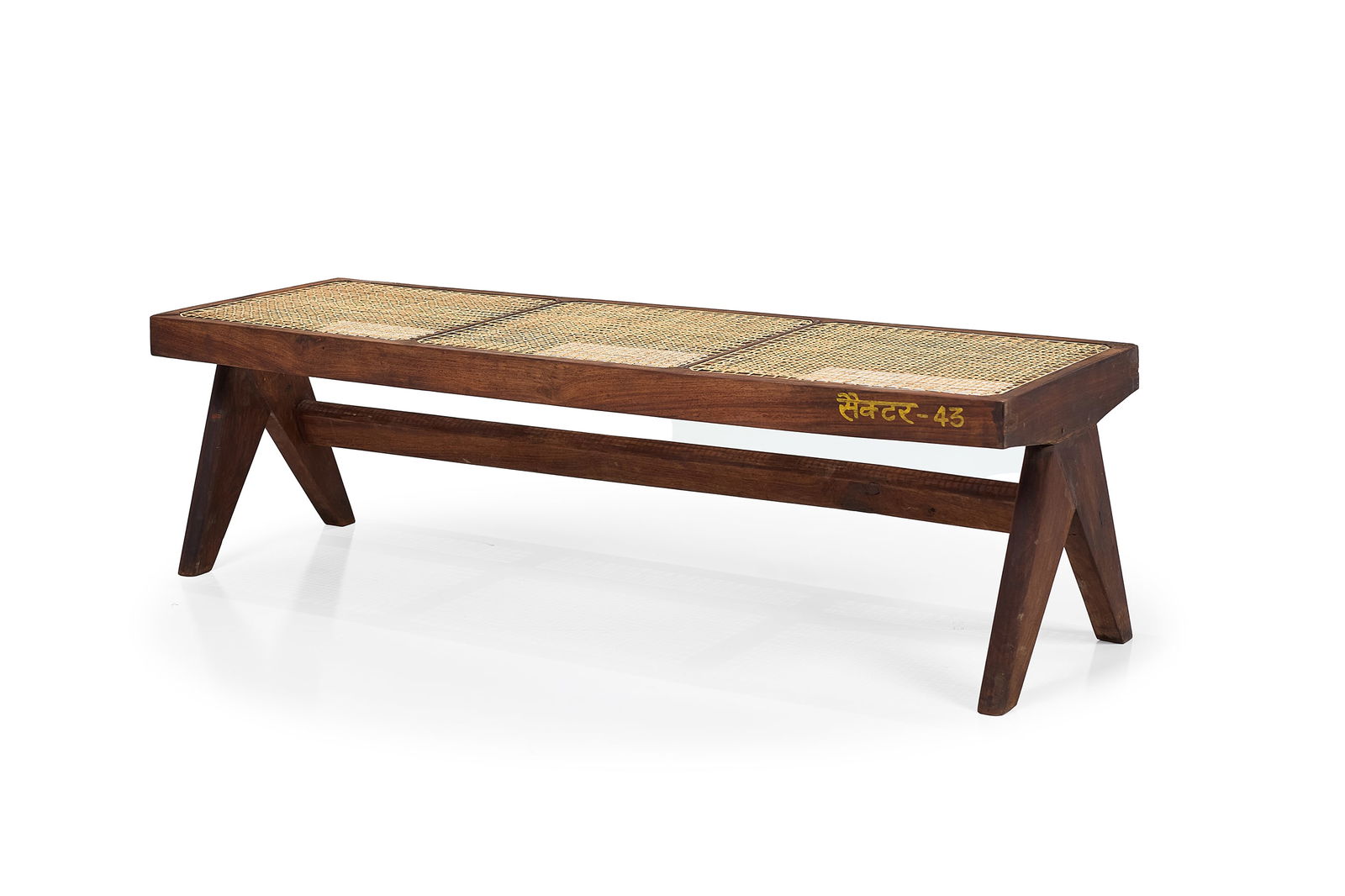 Pierre Jeanneret, Bench: PIERRE JEANNERETBench from the M.L.A. Flats building, Chandigarh, ca. 1956Teak, cane. Produced in France / India for Punjab University, Chandigarh, India.Stencilled marking along seat edge. 