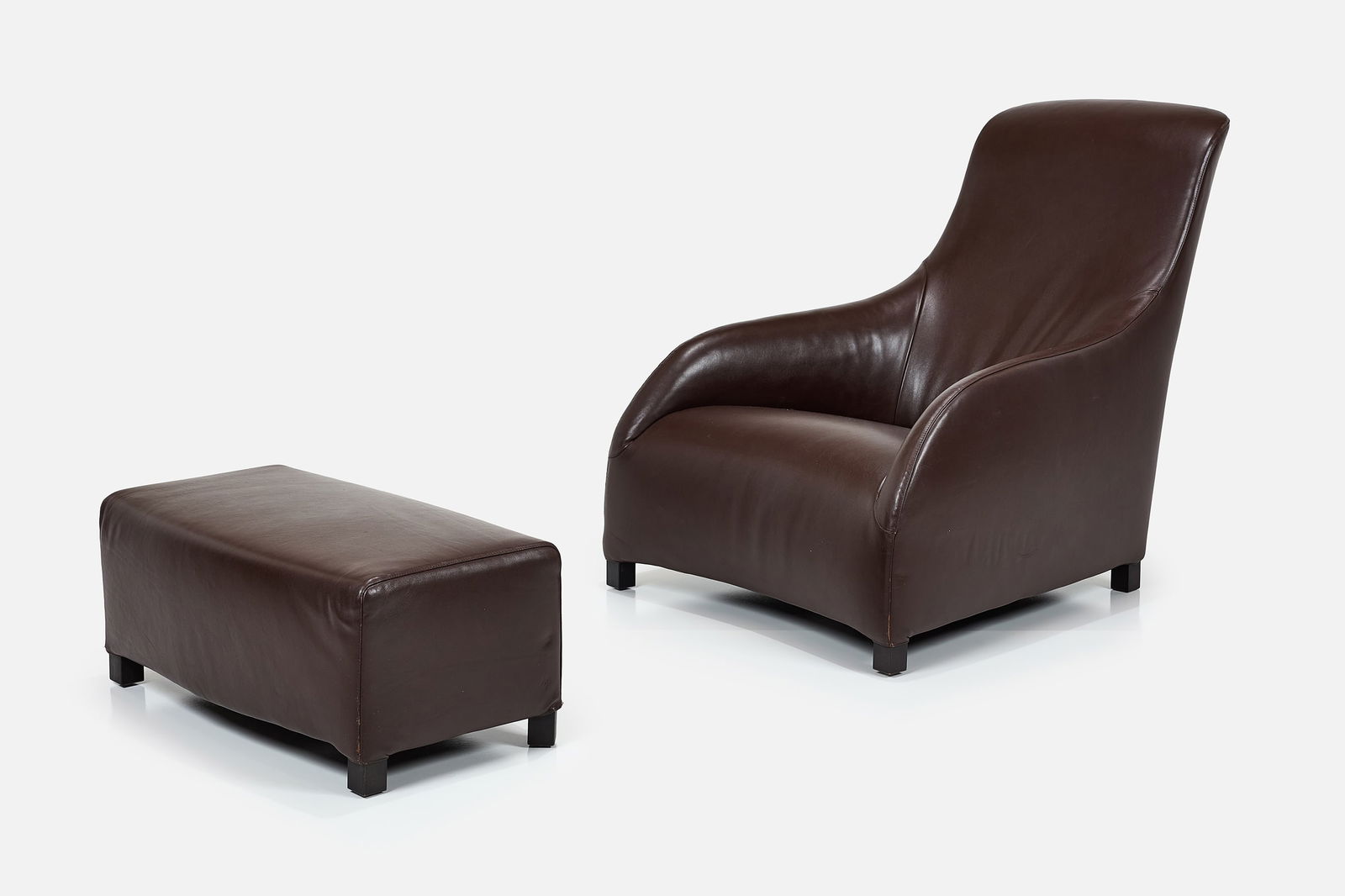Antonio Citterio, 'Apta' Lounge Chair + Ottoman (2): ANTONIO CITTERIO 'Apta' lounge chair and ottoman, 2007 Leather, ebonized wood. Manufactured by B&B Italia, Italy. Underside of each with manufacturer's label. Chair: 34.5" H