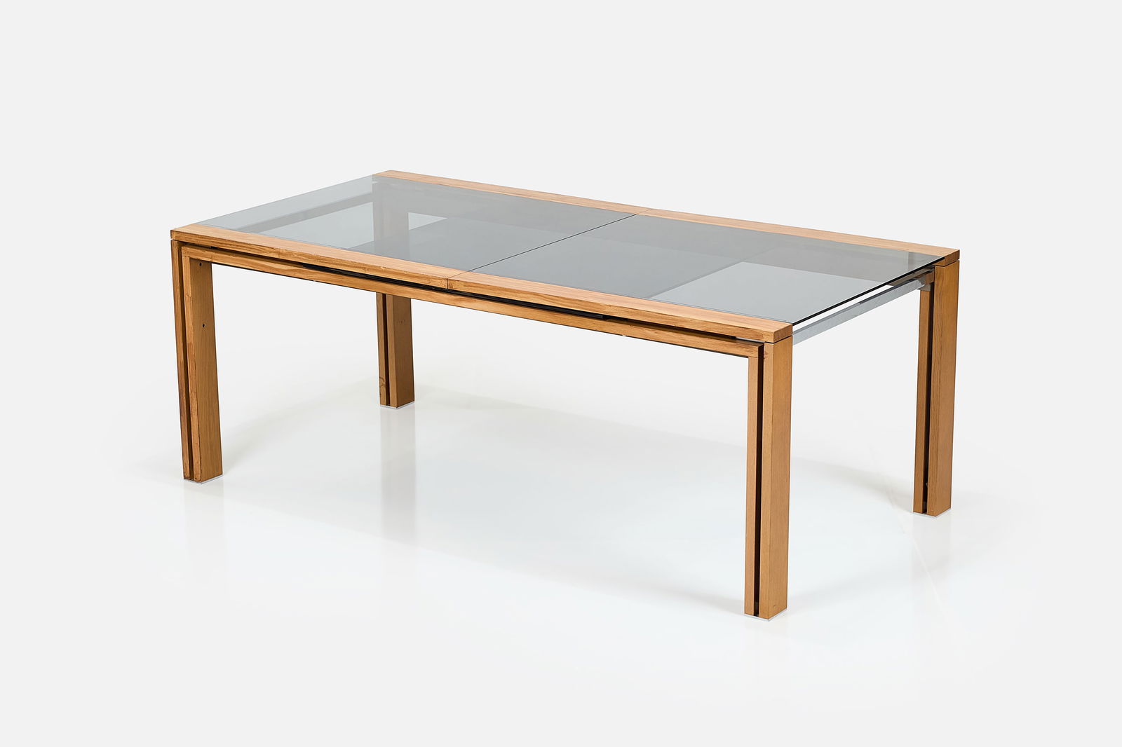 Roche-Bobois, 'Glassbox' Dining Table: ROCHE-BOBOIS 'Glassbox' dining table with integrated extensions, 2010s Smoked glass, bleached oak, stainless steel. Manufactured by Roche-Bobois, France. 30Êº H x 79" -