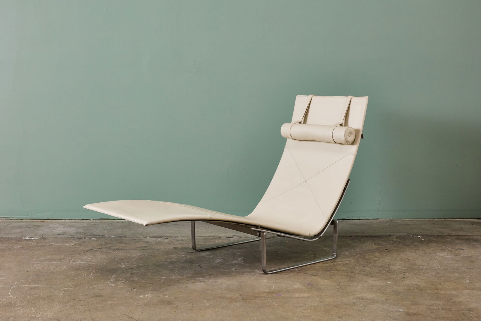 Poul Kjaerholm, PK24 Chaise Lounge: POUL KJAERHOLM Chaise lounge, model no. PK24, 1965 / ca. 2000 Leather, brushed spring steel. Manufactured by Fritz Hansen, Denmark. Base with impressed manufacturer's mark and