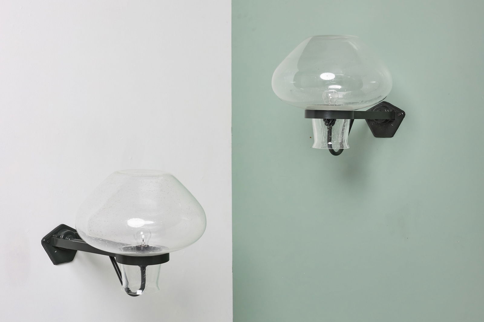 Erik Gunnar Asplund, 'GA9' Wall Sconces (2): ERIK GUNNAR ASPLUND Pair of wall lights, model no. GA9, 1940s Glass, patinated metal. Manufactured by ASEA, Sweden. Each: 14" H x 13.5" W x 22" D