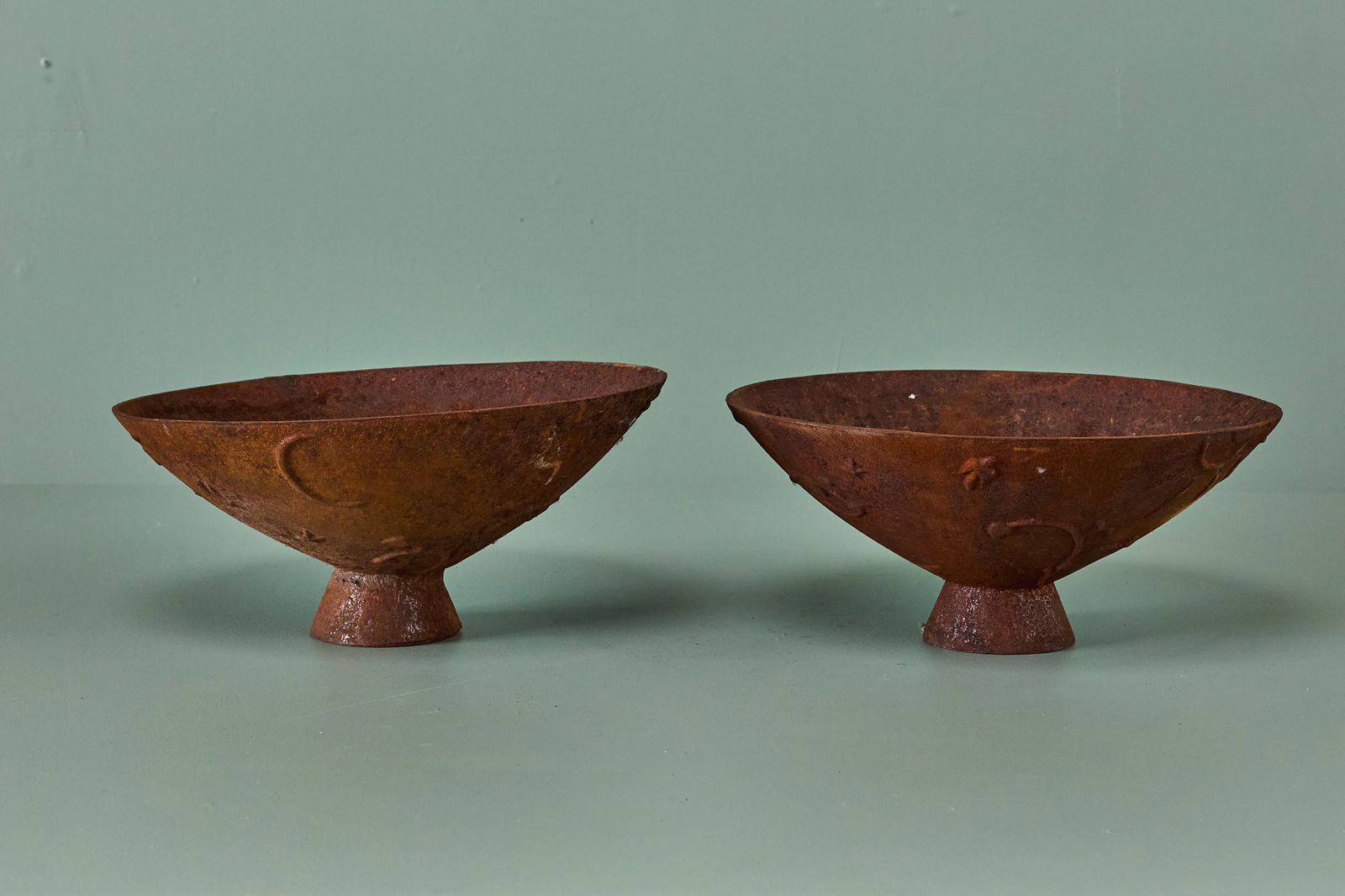 Olof Hult, 'Mikrokosmos' Planters (2): OLOF HULT Pair of 'Mikrokosmos' planters, ca. 1922 Cast iron. Produced by Nafveqvarns Bruk, Sweden. Each: 6.25" H x 15" Diameter These
