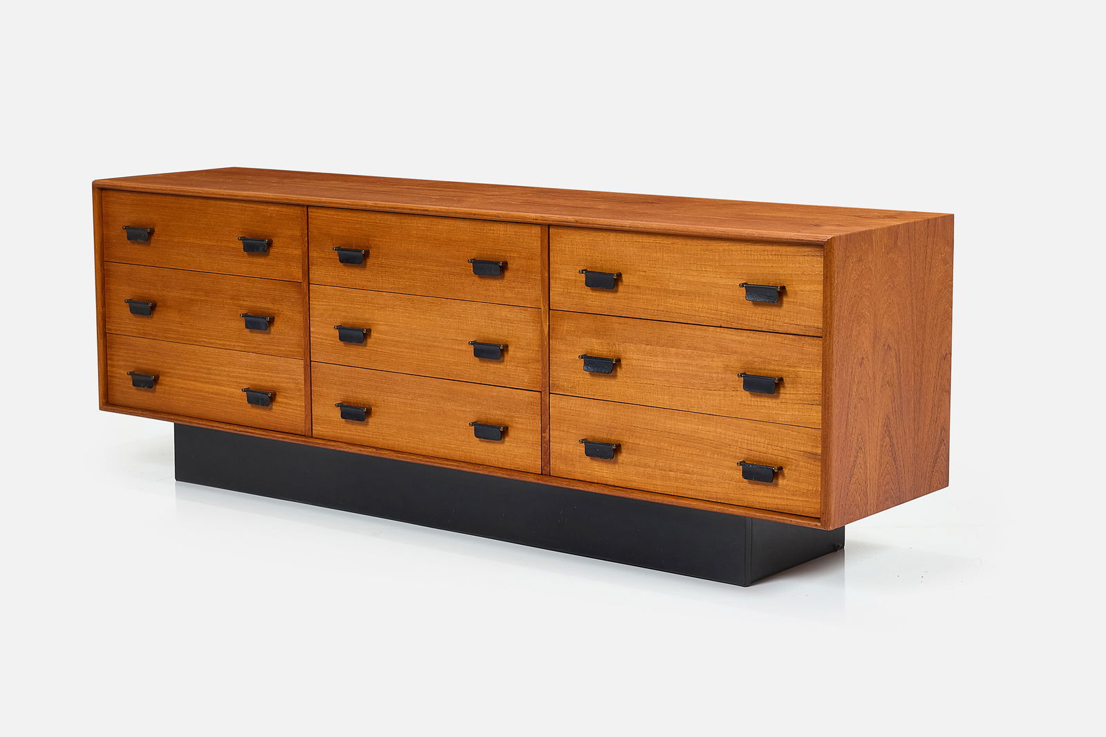 Danish, Nine-Drawer Dresser: DANISH Nine-drawer dresser, 1960s Walnut, painted wood, brass, leather. 26.75" H x 75.75" W x 18.25" D