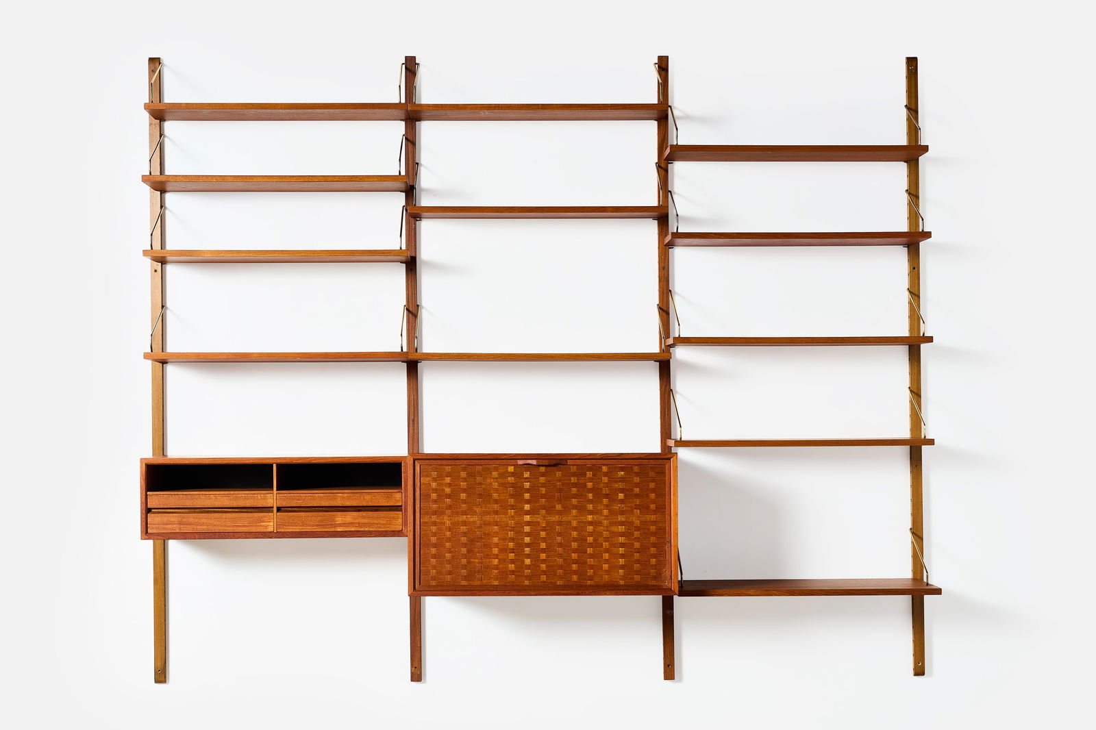 Poul Cadovious, 'Royal' Wall Unit: POUL CADOVIOUS 'Royal' wall mounted shelving unit, 1960s Teak, brass. Manufactured by Cado, Denmark. 77" H x 95" W x 16" D