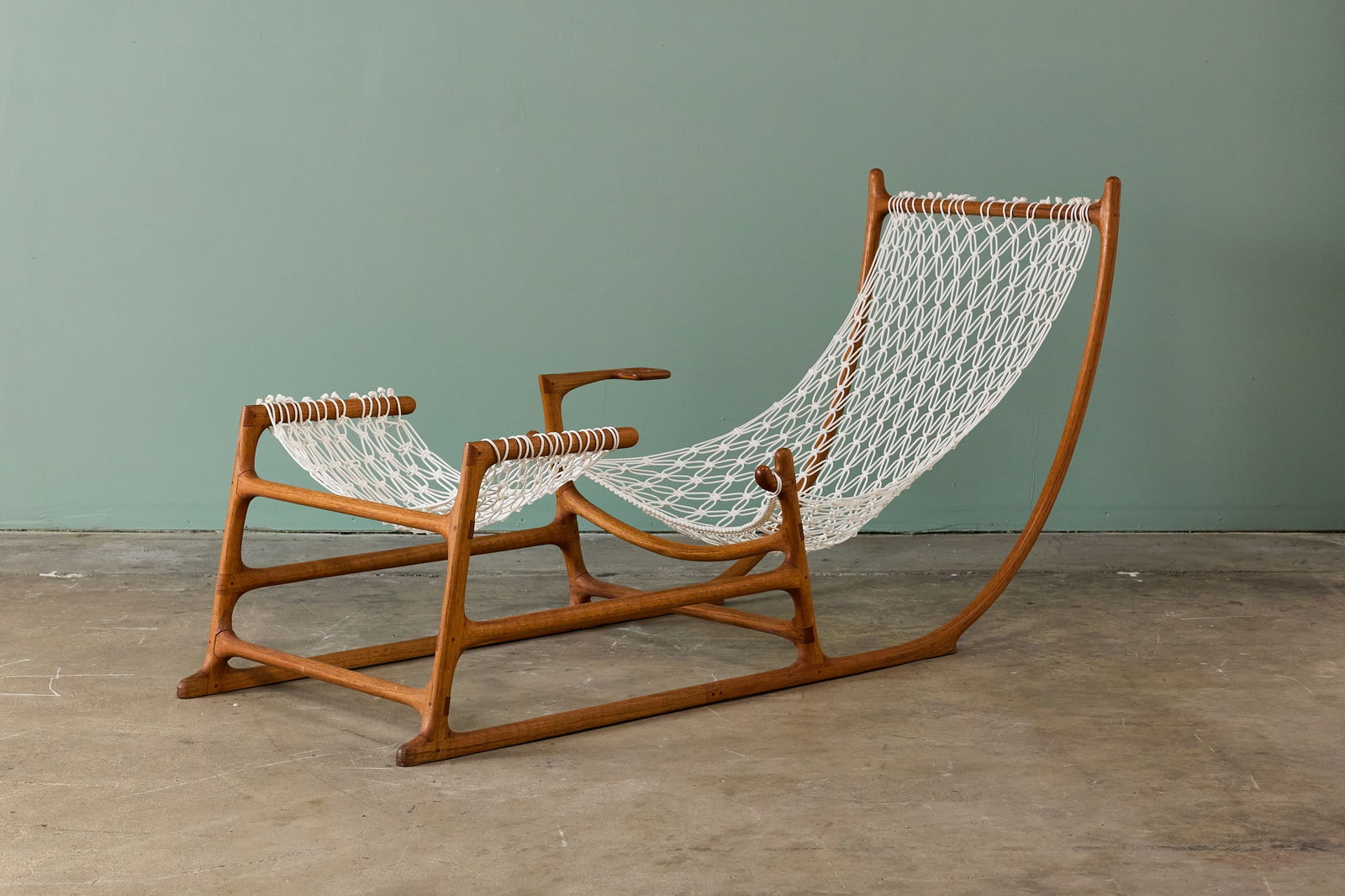 William C. Leete, Rare 'Sleigh' Hammock Chair: WILLIAM C. LEETE 'Sleigh' hammock chair, 1970s Red oak, nylon cording. Studio-made, USA. 37.5" H x 28" W x 77" D Literature: Dona Z. Meilach, Creating