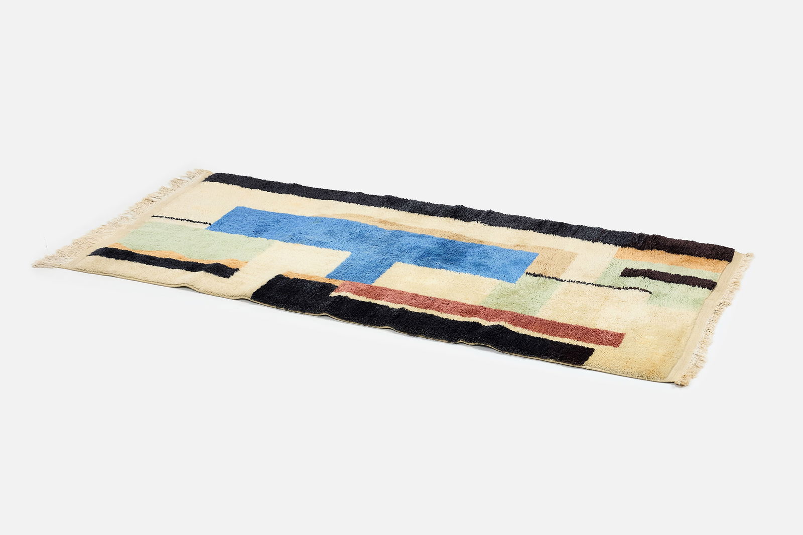 After Fernand Leger, 'Blanc' Rug (8' 5" x 3' 10"): AFTER FERNAND LEGER 'Blanc' rug, mid-20th century Hand-knotted wool. Produced by Artis, France. Woven manufacturer's mark to reverse ‘Artis’. 101" x 46" 