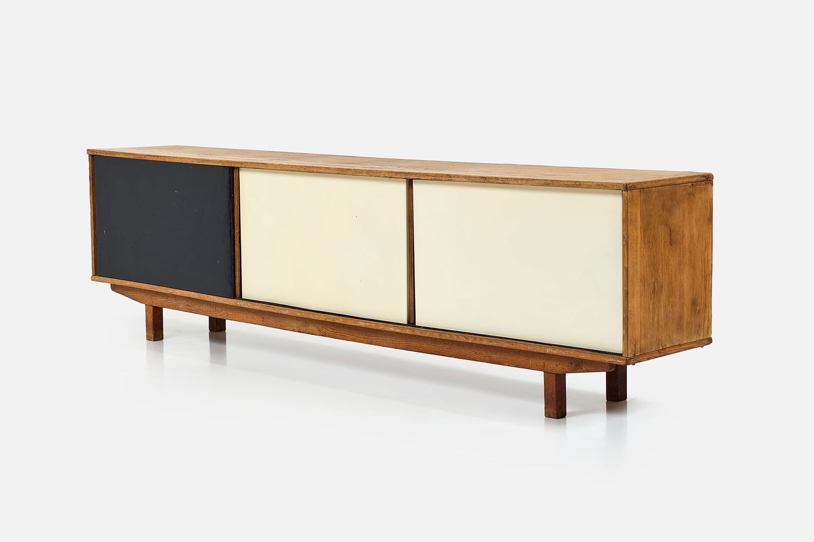 French, Credenza: FRENCHCredenza, 1950sOak, painted wood. 27.5" H x 98.25" W x 16.5" D