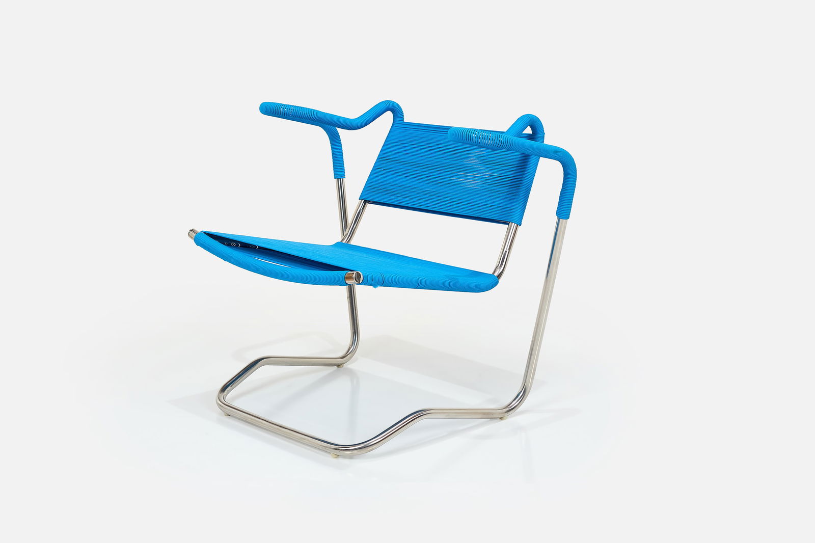 Dan Johnson, Lounge Chair: DAN JOHNSONLounge chair, 1950s / 2000sStainless steel, nylon cord. Produced by California Living, USA. 28.5" H x 32.5" W x 26.5" DSeat height: 17.5" This chair was pr
