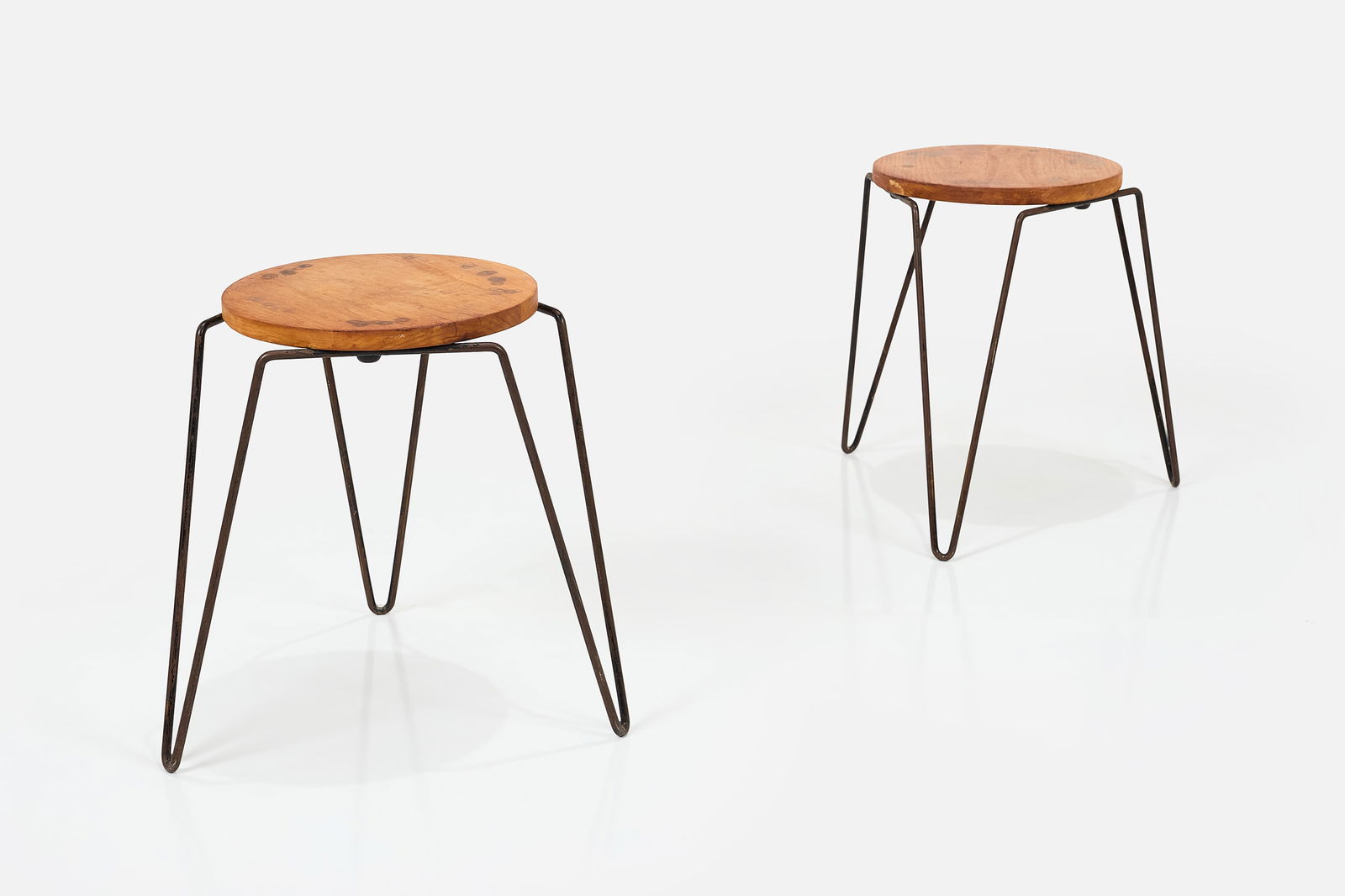 Florence Knoll, Stacking Stools (2): FLORENCE KNOLL Pair of stacking stools / tables, model no. 75, ca. 1950 Plywood, painted steel rod. Manufactured by Knoll Associates, USA. Each: 18" H x 17" Diameter