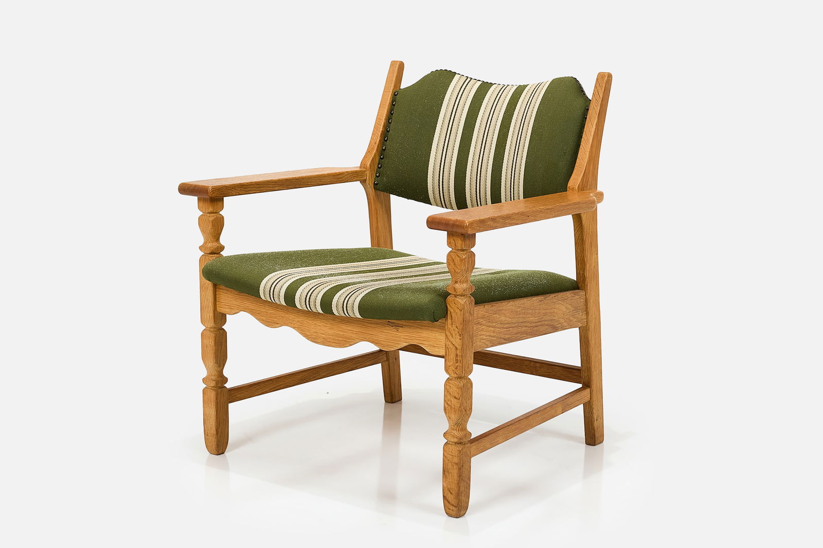 Henning Kjaernulf, Lounge Chair: HENNING KJAERNULF Lounge chair, 1960s Oak, fabric. Manufactured by Nyrup Mobelfabrik, Denmark. 29.75" H x 27.5" W x 25.5" D Seat height: 15"