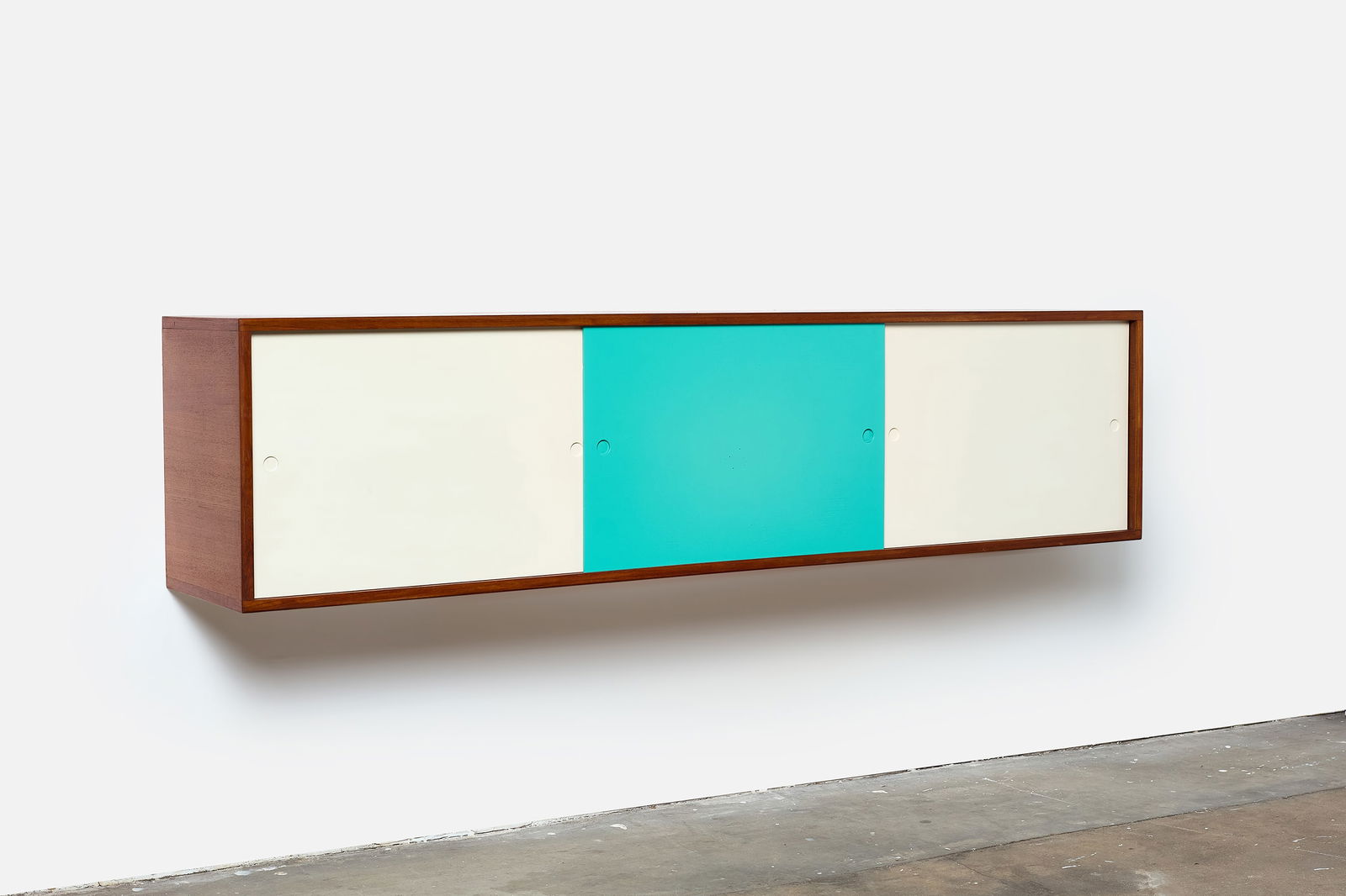 Heinrich Roepstorff, Wall-Mount Credenza: HEINRICH ROEPSTORFFLarge wall-mount cabinet, ca. 1955Teak, lacquered wood. Produced by Heinrich Roepstorff, Denmark. Back with manufacturer's label. 18" H x 74"