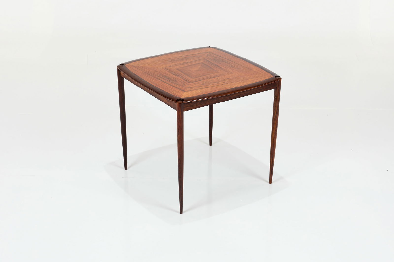 Sergio Rodrigues Style, Flip-Top Game Table: SERGIO RODRIGUES STYLE Flip-top game table, 1960s Rosewood, leather. 28.75" H x 31.5" W x 31.5" D