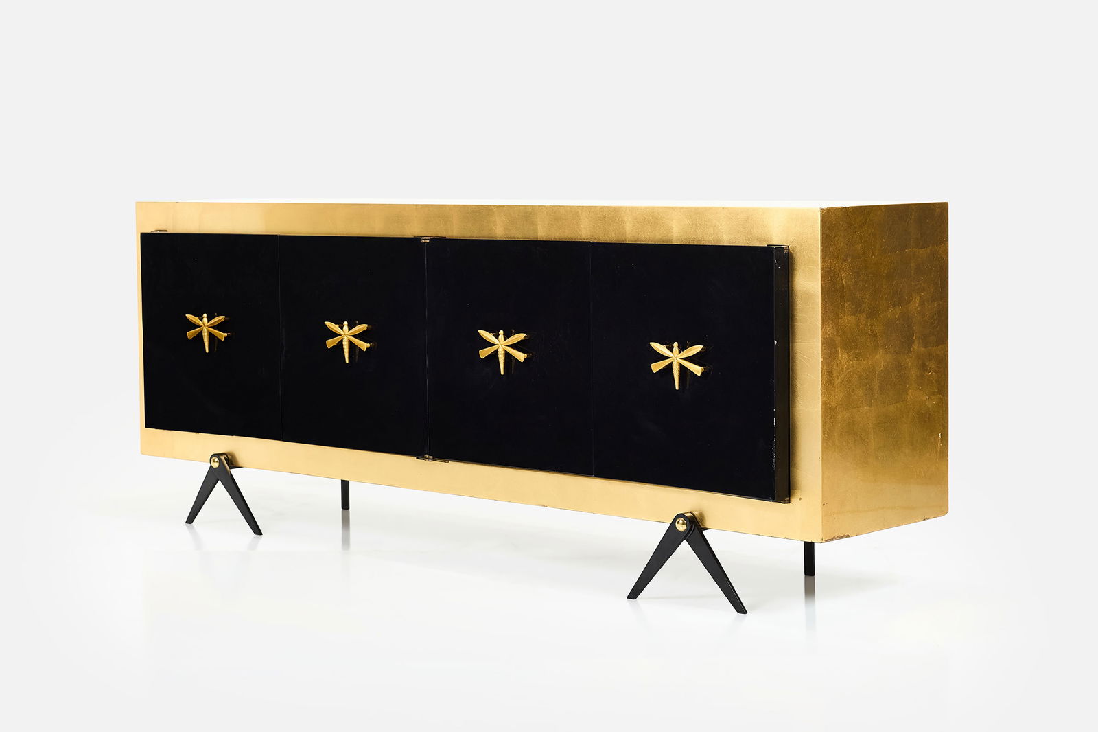 Arturo Pani (Attrib.), Credenza: ARTURO PANI (Attrib.)Credenza, 1950sGold leaf and lacquered wood, brass, steel. Produced in Mexico. 34" H x 91" W x 21" D