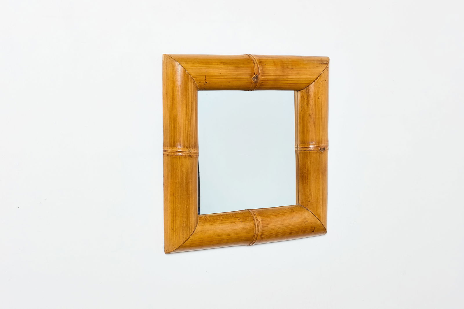 French, Bamboo Mirror: FRENCH Wall mirror, 1960s Bamboo, mirrored glass. 27.5" H x 27.5" W x 3" D