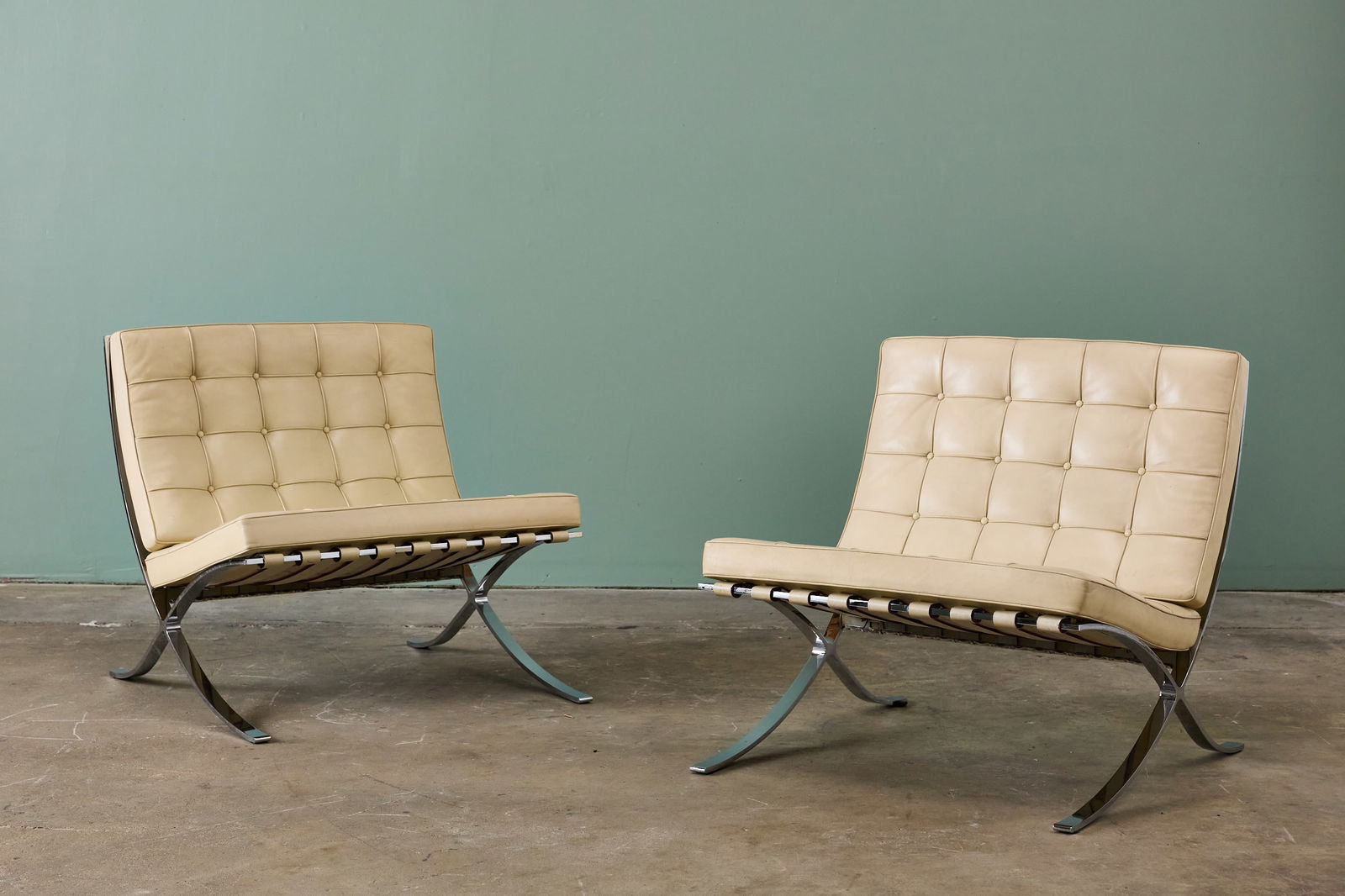 Ludwig Mies van der Rohe, 'Barcelona' Chairs (2): LUDWIG MIES VAN DER ROHE Pair of 'Barcelona' chairs, 1970s Flat steel, leather. Manufactured by Knoll, USA. Underside with manufacturer's branded decking. Each: 29.5" H x