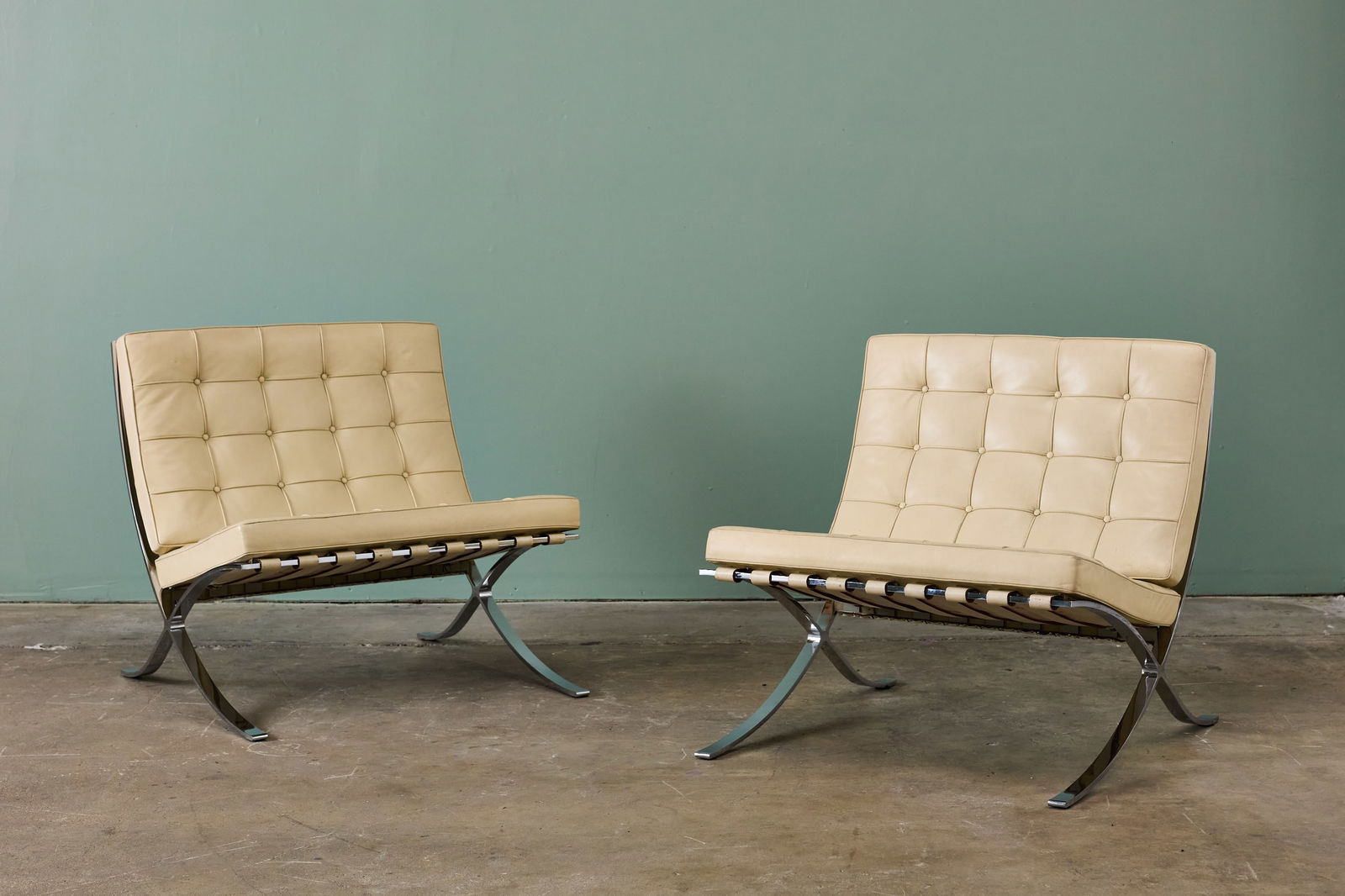 Ludwig Mies van der Rohe, 'Barcelona' Chairs (2): LUDWIG MIES VAN DER ROHE Pair of 'Barcelona' chairs, 1970s Flat steel, leather. Manufactured by Knoll, USA. Underside with manufacturer's branded decking. Each: 29.5" H x