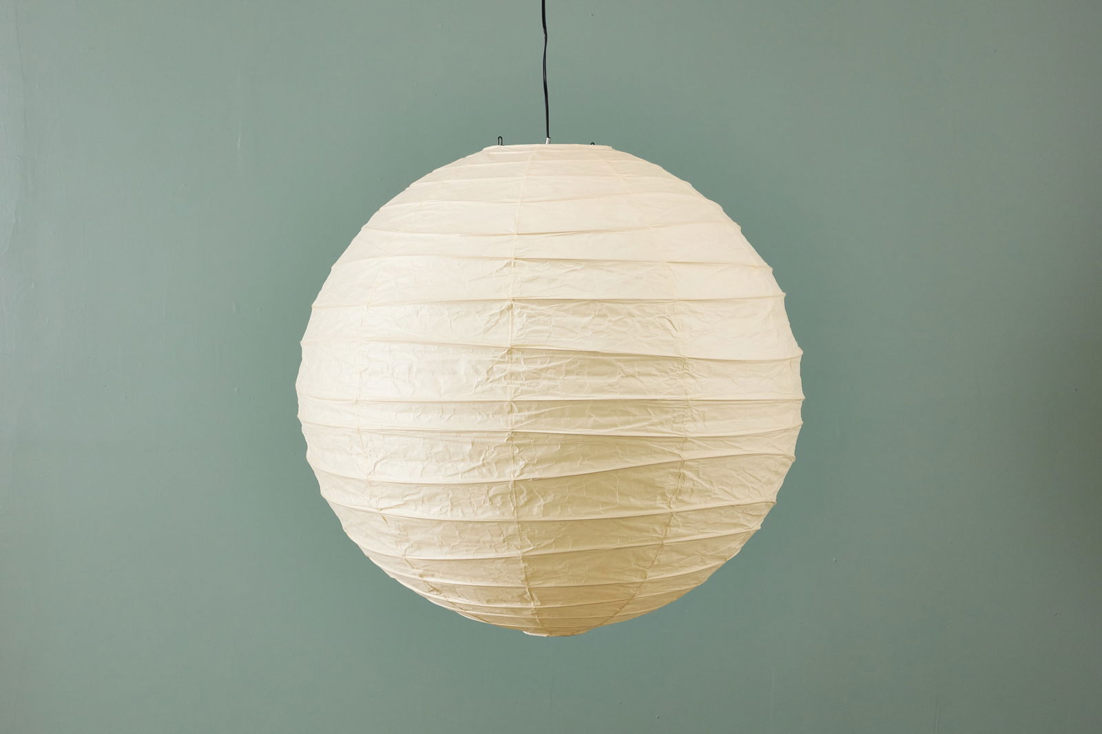 Isamu Noguchi, 'Akari' Hanging Light Sculpture: ISAMU NOGUCHI Hanging 'Akari' light sculpture, model no. 100D, 2000s Washi paper, bamboo. Produced by Ozeki & Co., Ltd., Japan. With printed mark. 39" Diameter
