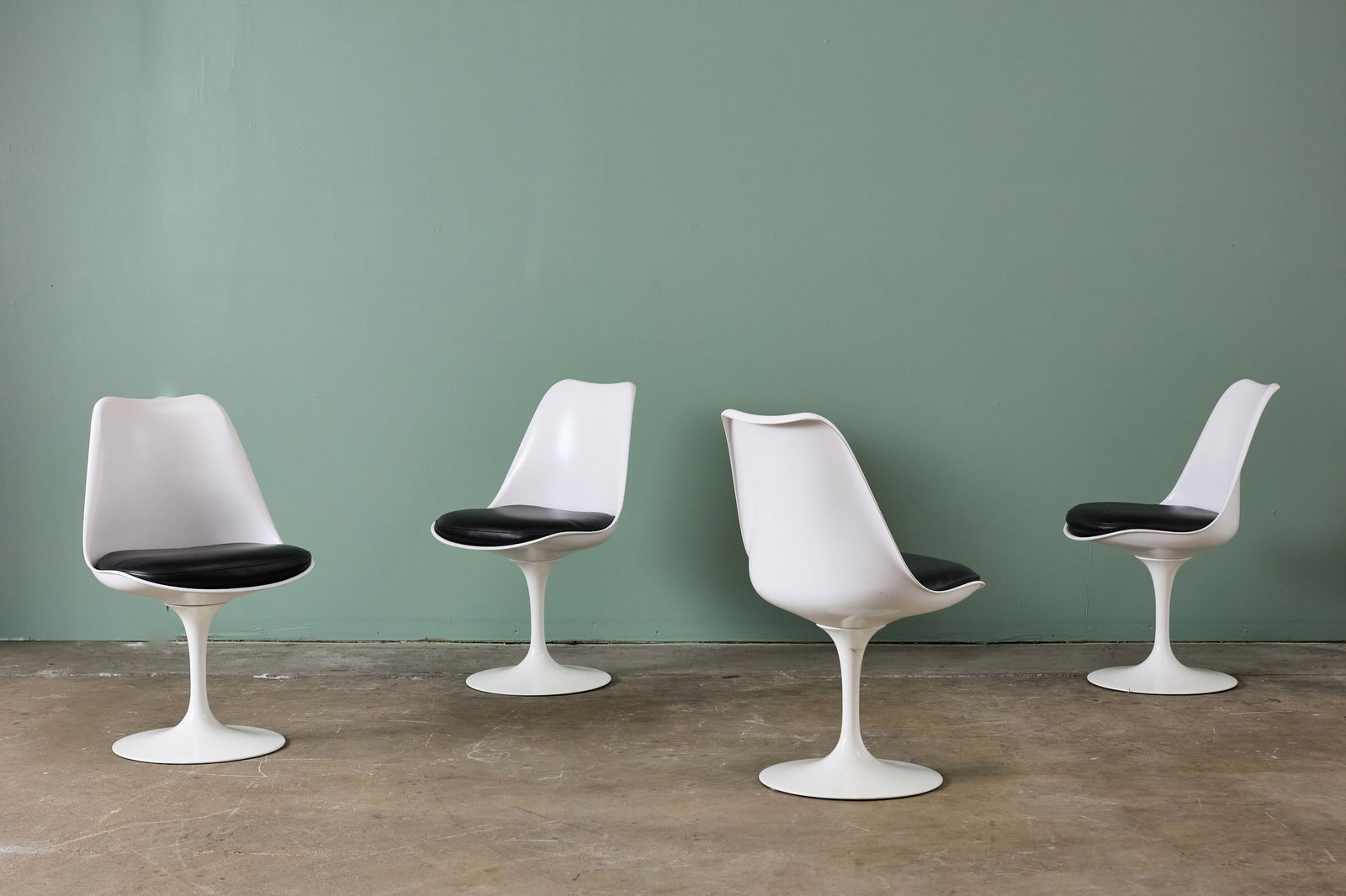 Eero Saarinen, 'Tulip' Chairs (4): EERO SAARINEN Set of four 'Tulip' dining chairs, 1957 / 2010s Molded fiberglass, lacquered cast aluminum, leather, fabric. Manufactured by Knoll, USA. Underside of bases molded