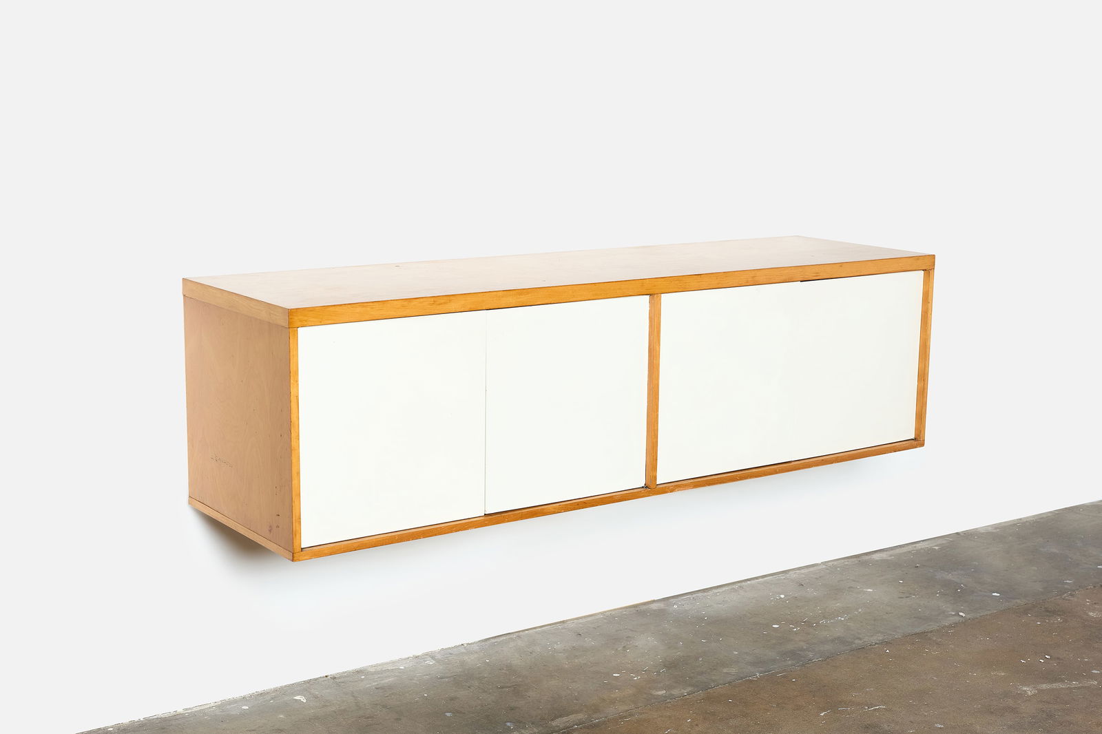 Knoll Style, Wall-Mount Cabinet: KNOLL STYLE Wall-mount cabinet, 1960s Birch, painted wood. 20" H x 72" W x 20" D