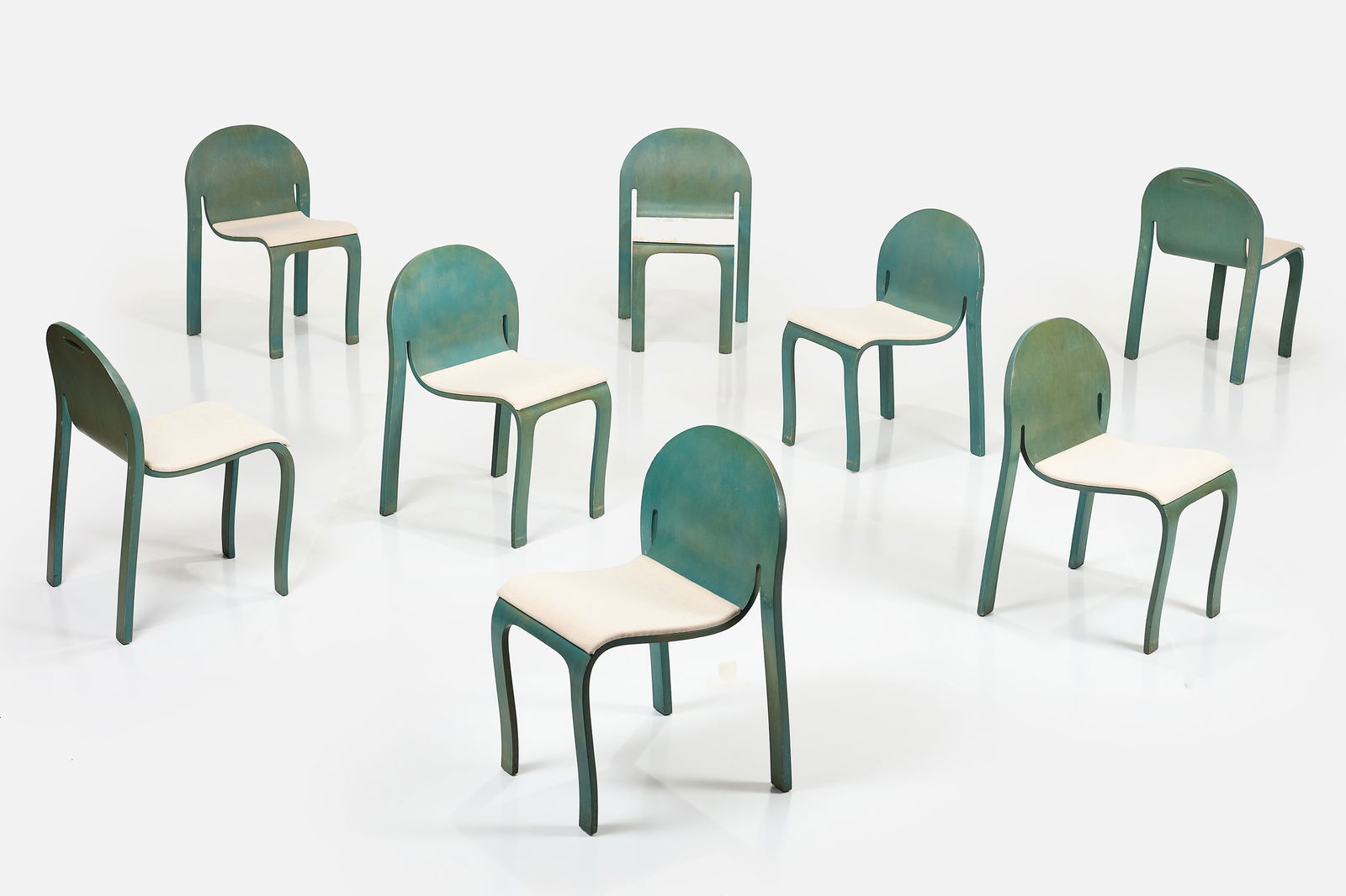 Peter Danko, 'Bodyform' Chairs (8): PETER DANKO Set of eight 'Bodyform' chairs, Lacquered molded plywood, fabric. Manufactured by Peter Danko Inc., USA. Underside of each with manufacturer's label. Each: 31.5" x