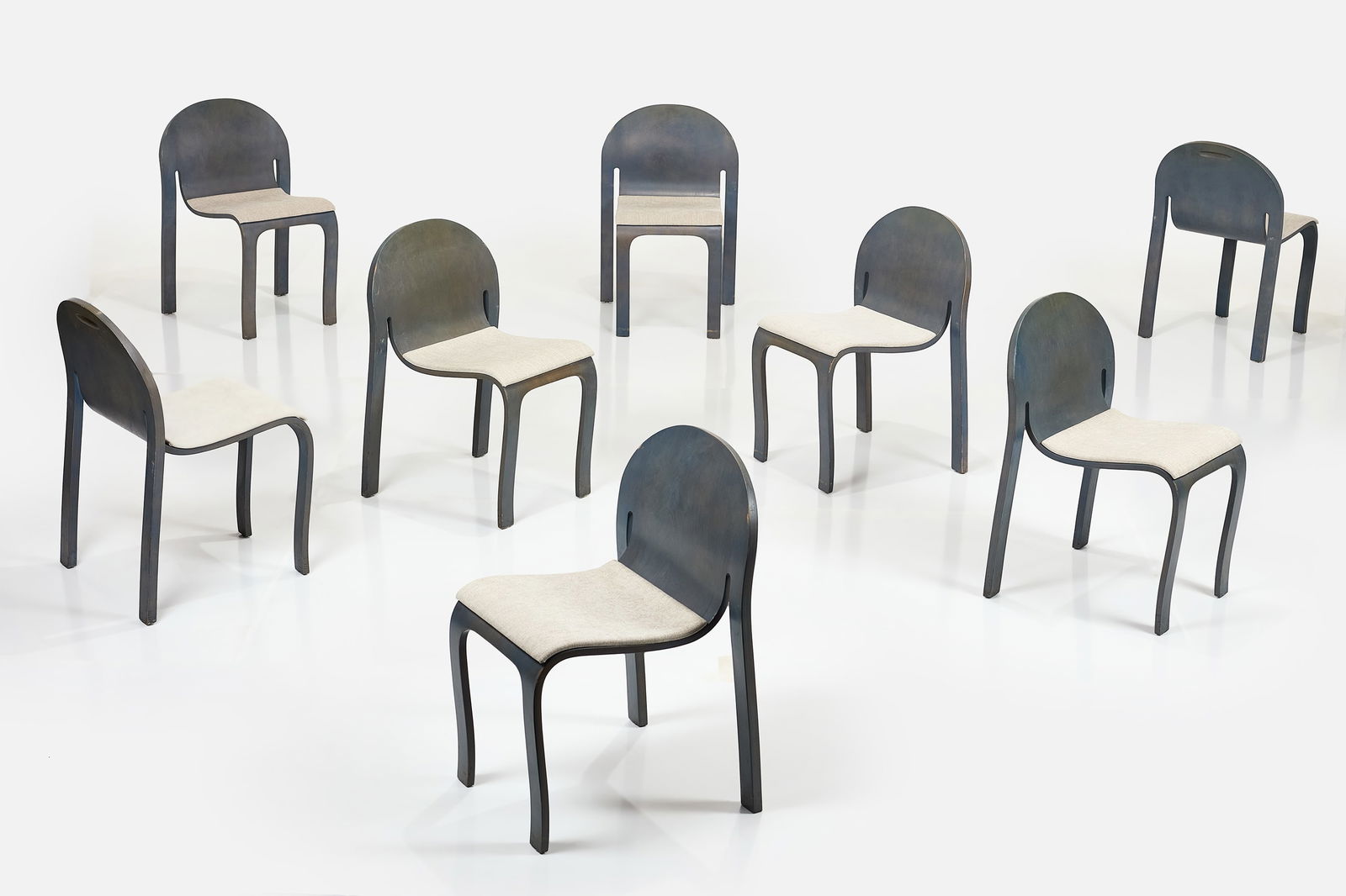 Peter Danko, 'Bodyform' Chairs (8): PETER DANKO Set of eight 'Bodyform' chairs, ca. 1980 Lacquered molded plywood, fabric. Manufactured by Peter Danko and Associates, Inc., USA. Underside of each with manufacturer's