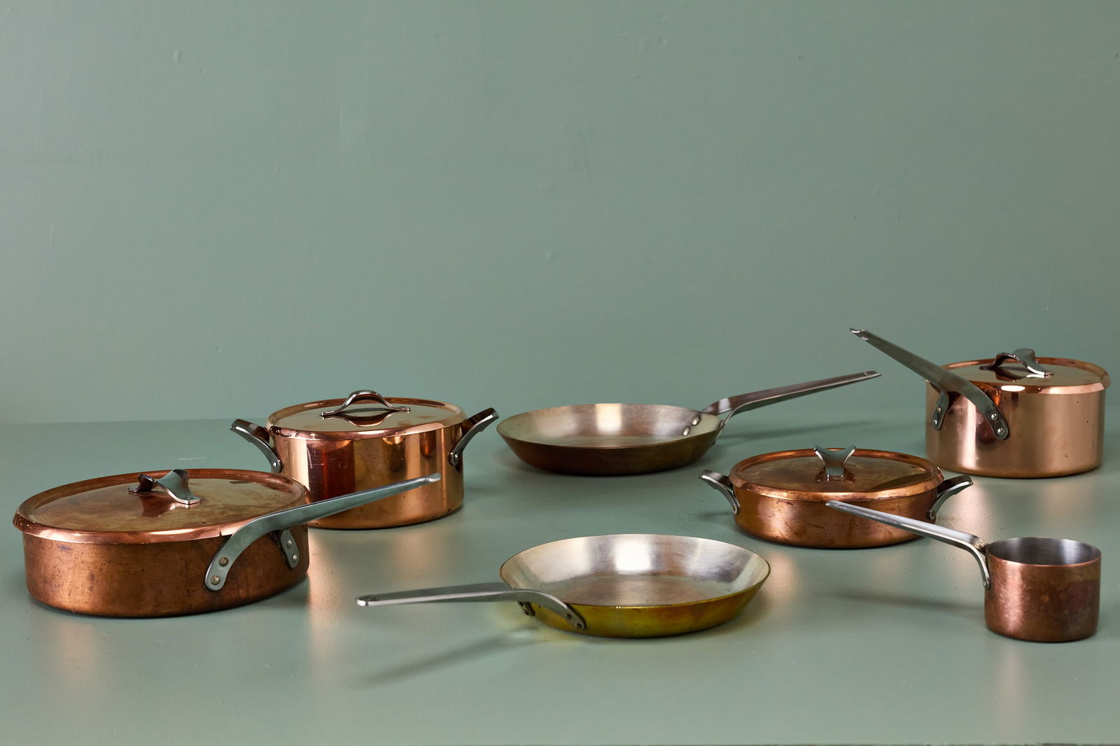 Henning Koppel, 'Taverna' Cookware (7): HENNING KOPPEL Seven-piece set of 'Taverna' cookware, designed 1918 Copper, steel. Manufactured by Georg Jensen, Denmark. Each impressed "GEORG JENSEN DESIGN / HK / DENMARK".