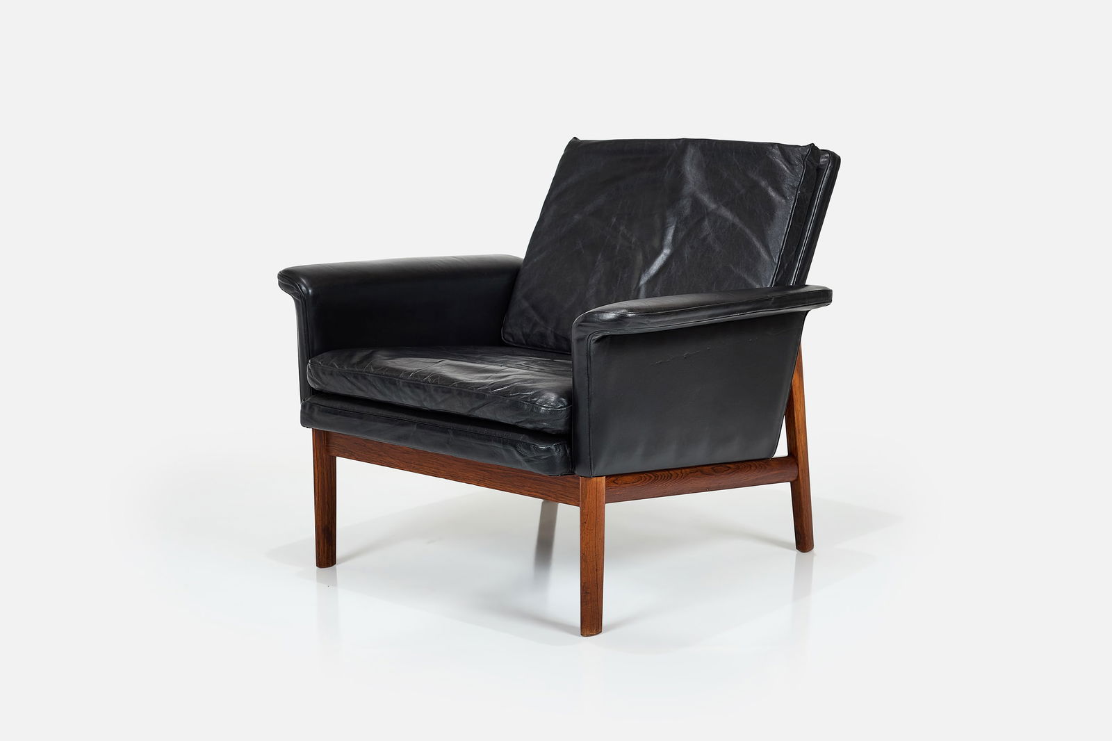 Finn Juhl, 'Jupiter' Lounge Chair: FINN JUHL'Jupiter' lounge chair, model no. 218, 1960sLeather, rosewood. Manufactured by France & Sons, Denmark.Underside with manufacturer's stamps and plates. 29" H