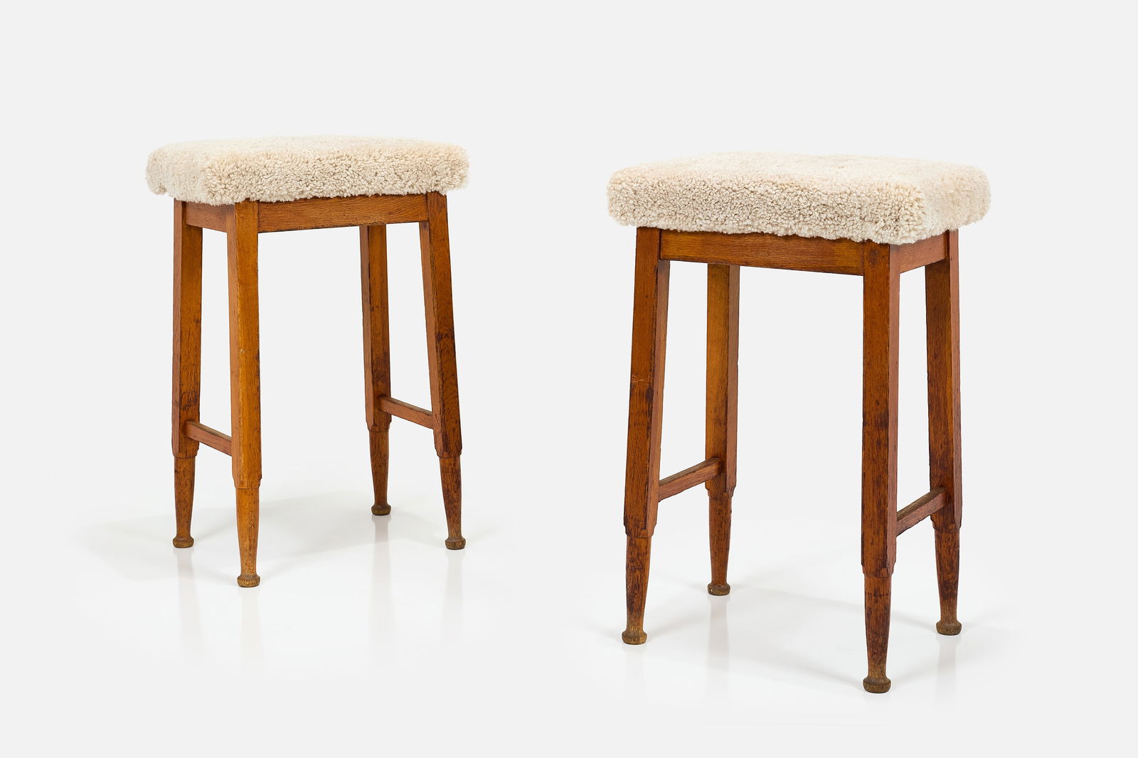 Danish, Barstools (2): DANISHPair of barstools, 1960sOak, faux shearling. Produced by Dansk Kontormobelfabrik, Denmark.One stool with brass manufacturer's label. Each: 32" H x 21" W x 14" D