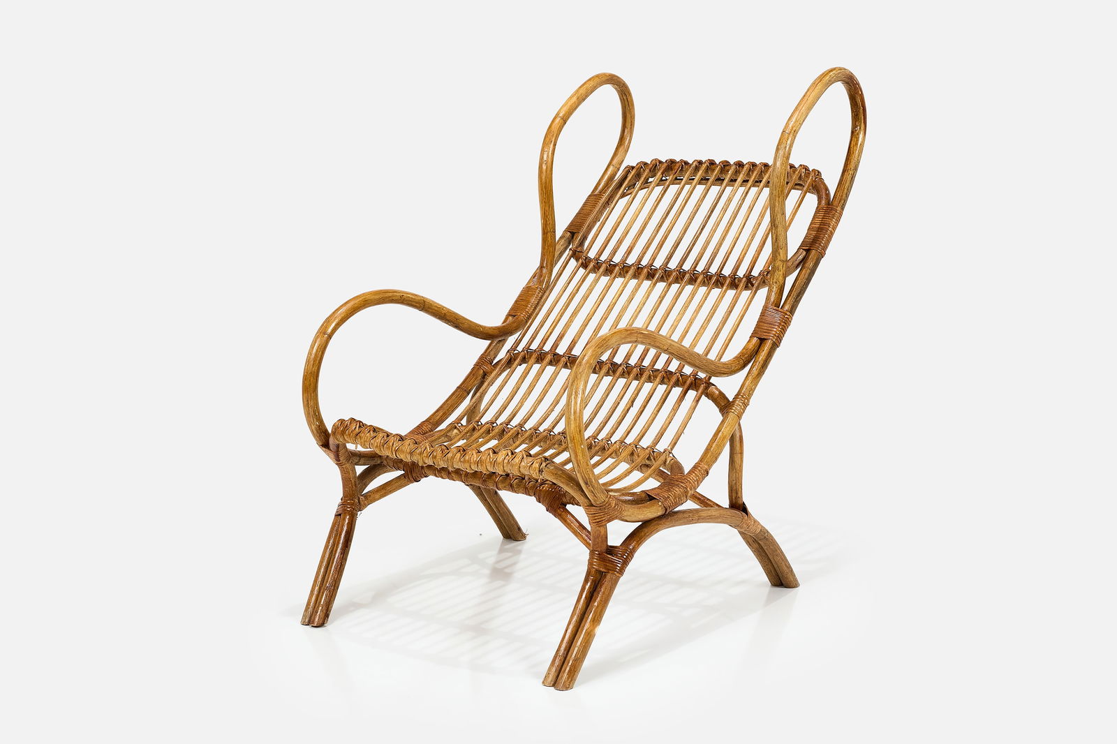 Gio Ponti, 'Continuum' Armchair: GIO PONTI 'Continuum' armchair, model no. BP 16, 1963 Rattan, cane. Produced by Bonacina, Italy. 40" H x 24.5" W x 33' D 