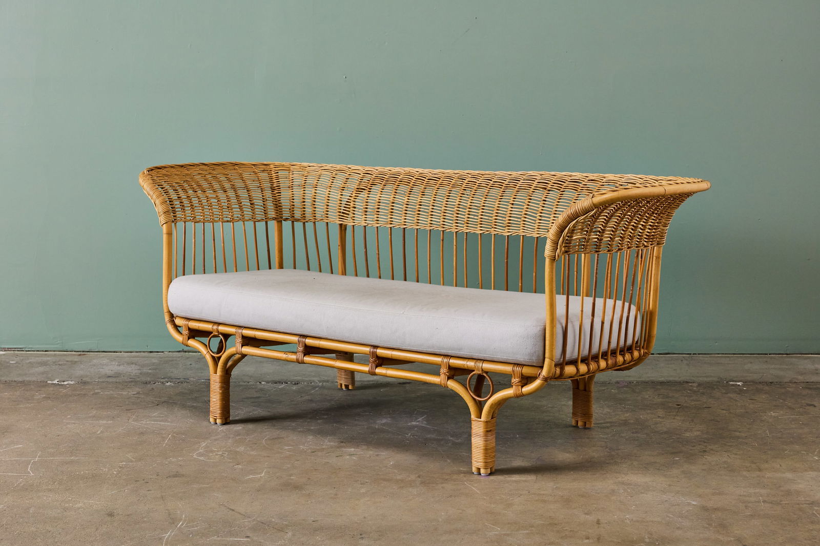 Franco Albini + Franca Helg, 'Belladonna' Settee: FRANCO ALBINI + FRANCA HELG'Belladonna' settee, 1951 / late 20th centuryRattan, fabric. Manufactured by Sika DesignUnderside with manufacturer's plate. 32" H x 76" W