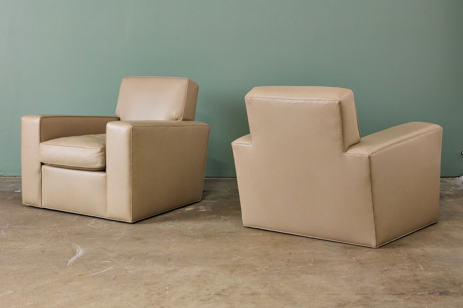 Jean-Michel Frank Style, Lounge Chairs (2): JEAN-MICHEL FRANK Pair of swivelling lounge chairs, 2010s Leather. Custom-made, USA. Each: 31" H x 36" W x 35" D Seat height: 18"