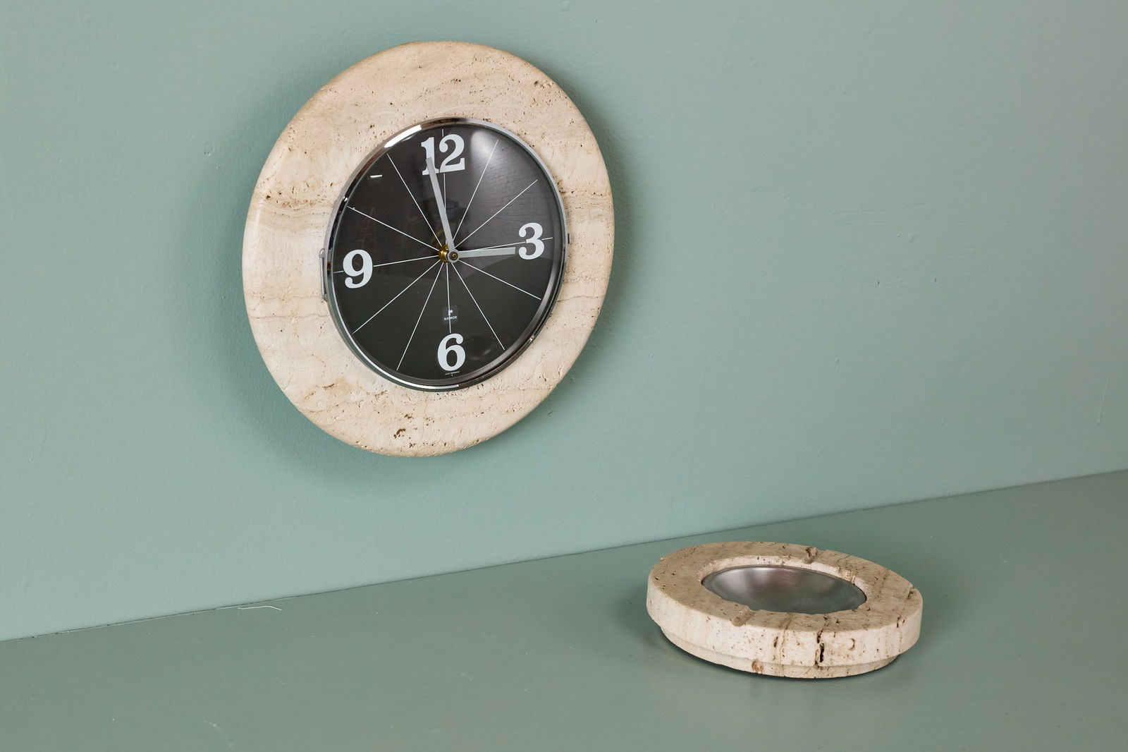 Raymor, Wall Clock + Dish (2): RAYMOR Wall clock and dish, 1960s Travertine, stainless steel, painted steel. Made in Italy for Raymor. Each with Raymor stickers, and clock additionally marked "WEST