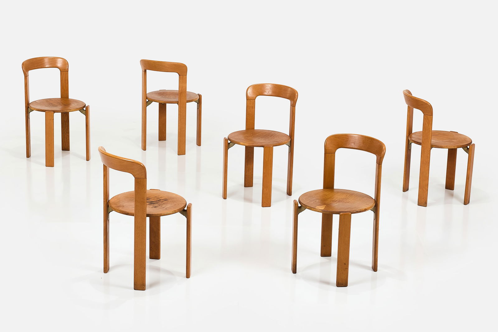 Bruno Rey, Stacking Dining Chairs (8): BRUNO REY Set of eight stacking chairs, ca. 1980 Beech, cast steel. Manufactured by Kusch Co., West Germany. Underside with manufacturer's sticker. Each: 30" H x 17.5" W x