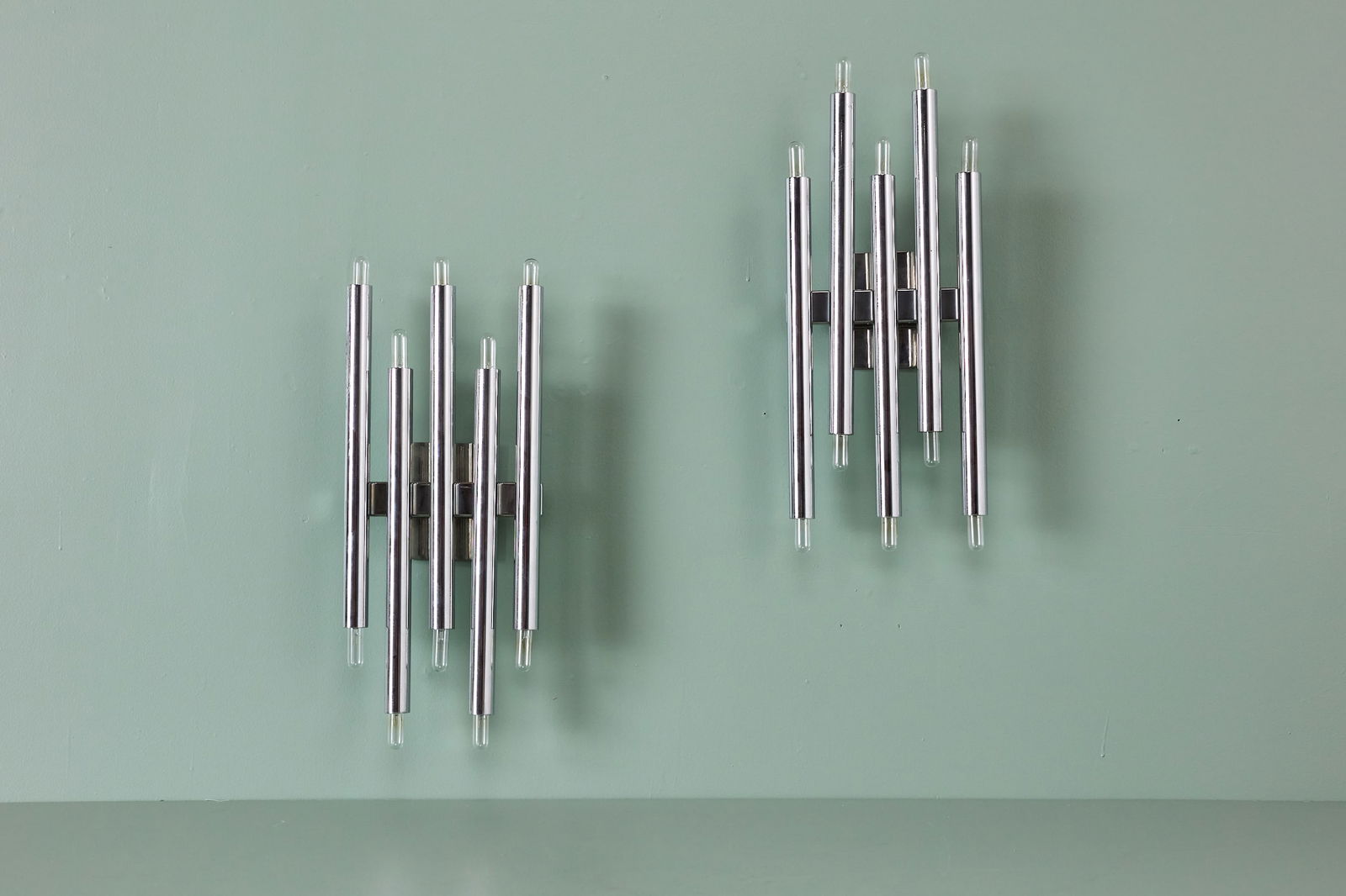 Goffredo Reggiani, Sconces (2): GOFFREDO REGGIANI Pair of sconces, 1970s Chrome. Produced in Italy. Each: 23" H x 9" W x 3.5" D