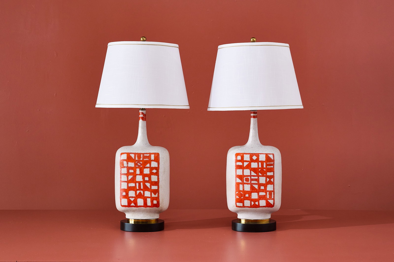Guido Gambone, Table Lamps (2): GUIDO GAMBONE Pair of table lamps, ca. 1955 Glazed stoneware, painted wood, brass. Made in Italy. Manufacturer's label and stamp underneath the base. Each: 33" H x 8.75" W x