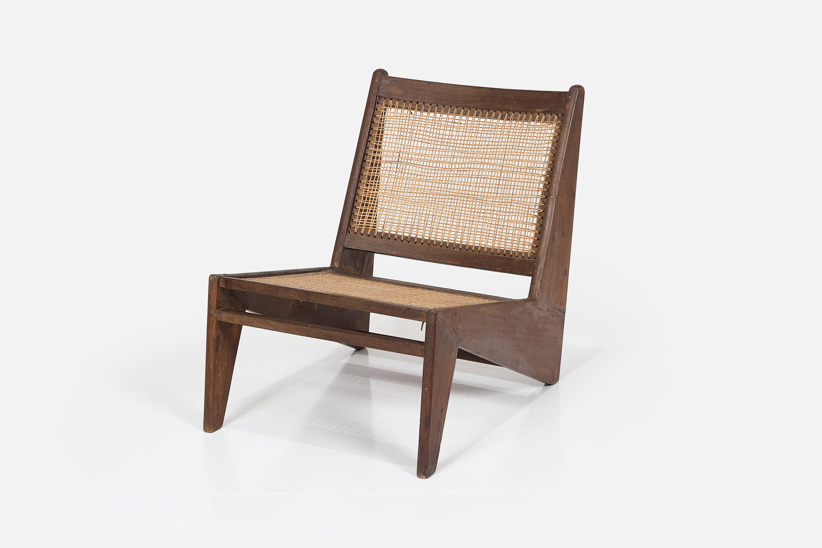 Pierre Jeanneret, 'Kangaroo' Chair: PIERRE JEANNERET 'Kangaroo' chair, ca. 1960 Teak, cane. Produced in France / India for Punjab University, Chandigarh, India. 26.5" H x 21" W x 30" D Seat height: