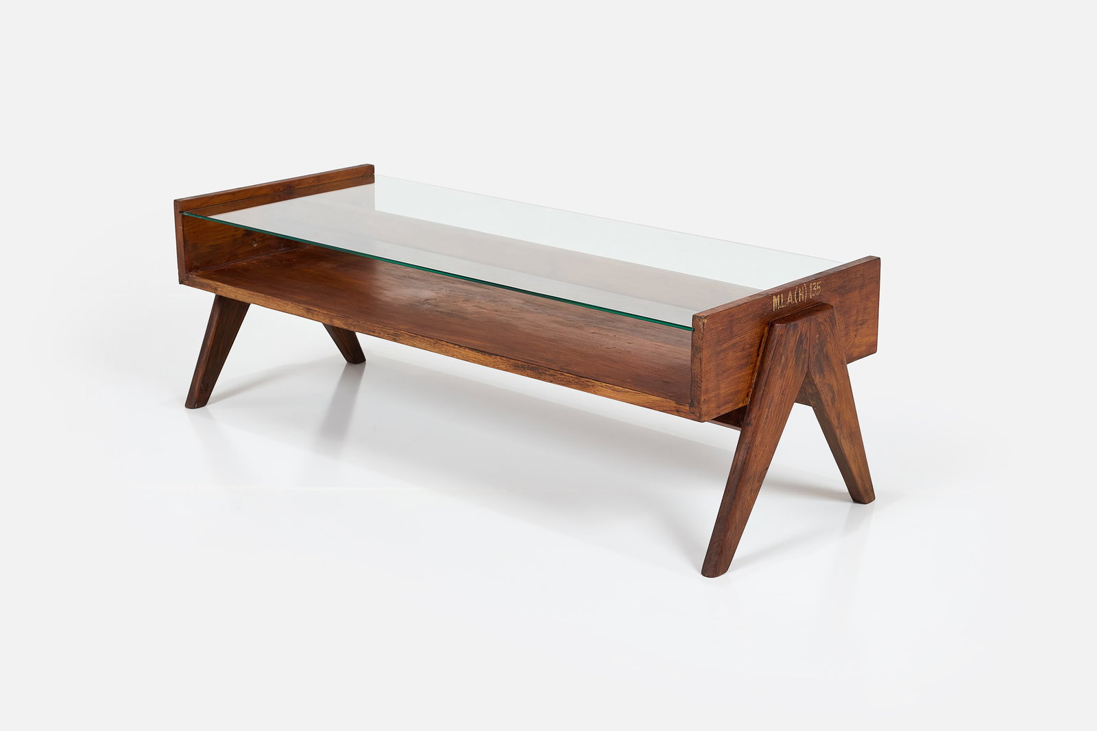 Pierre Jeanneret, Coffee Table: PIERRE JEANNERET Coffee table, from Chandigarh, ca. 1955 Teak, glass. Produced in France / India for Punjab University, Chandigarh, India. Frame with stencilled markings. 16" H