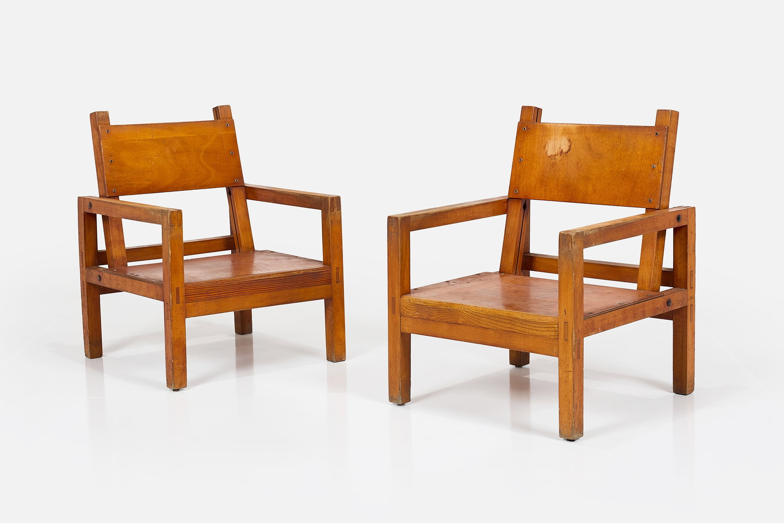 French, Plywood Lounge Chairs (2): FRENCH Pair of lounge chairs, 1960s Plywood, oak. Â Each: 34" H x 25.25" W x 25.5" D Seat heights: 13"